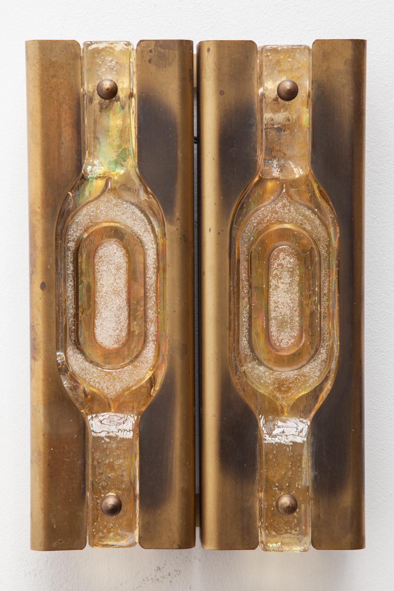 A pair of beautiful rectangular brass wall sconces with amber-colored textured Murano glass.