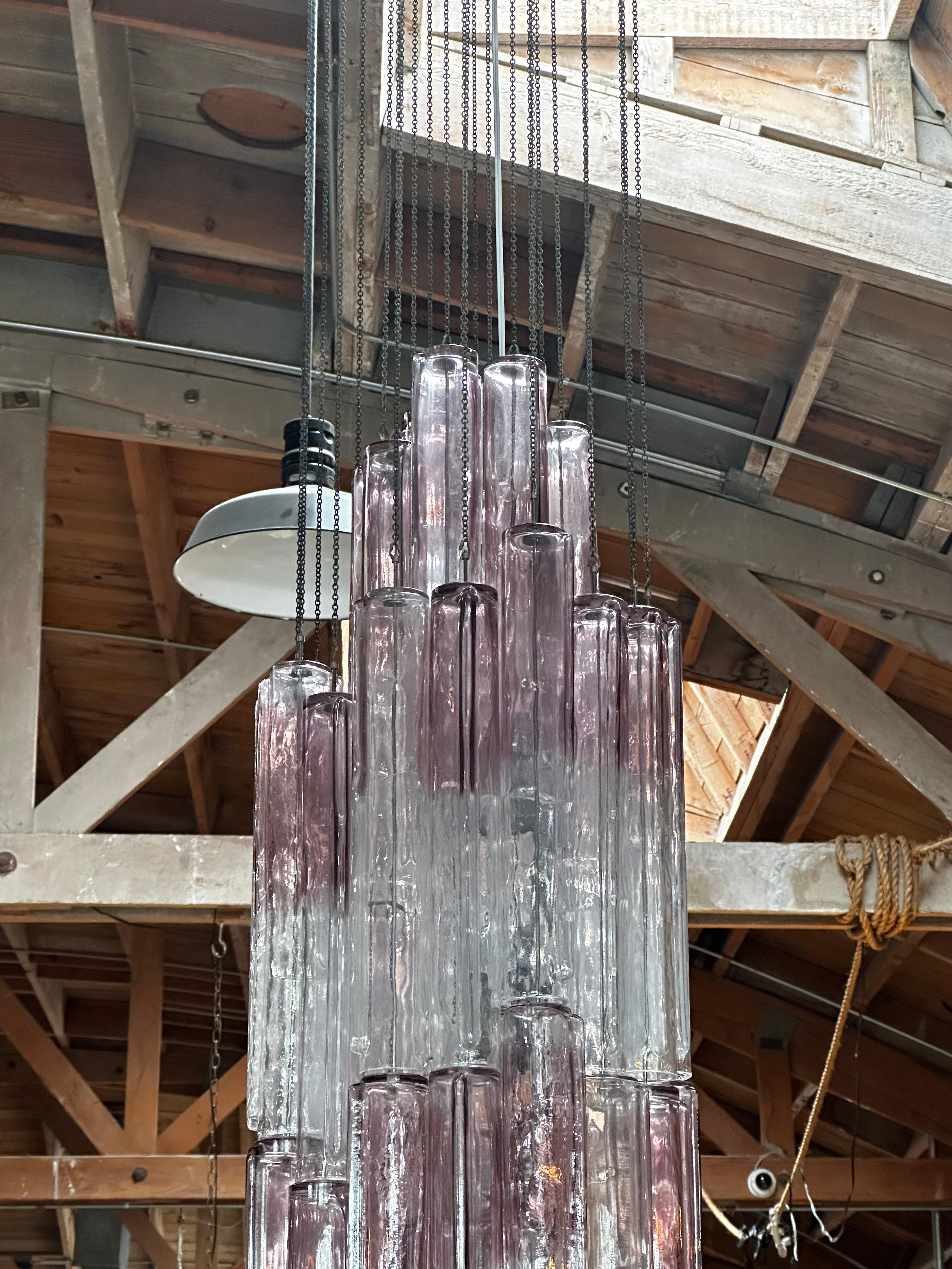 Mid-Century Modern chandelier by Carlo Nason for Mazzega in a blue opalescent hue, consisting of three stages of glass blades. This chandelier is complete as there is not one inch of space free where the blades hang from.
   