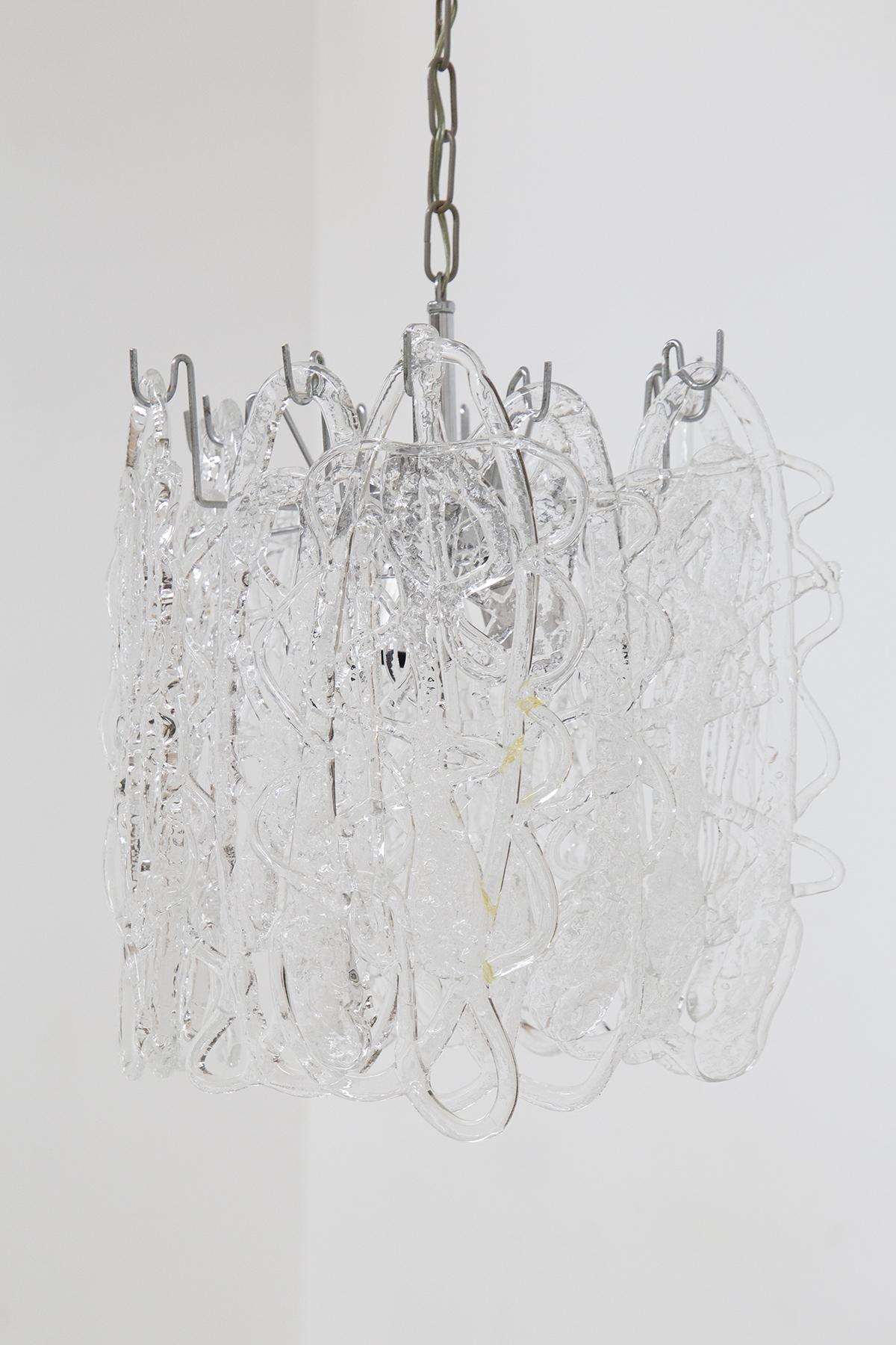 Elegant chandelier model Ragnatela by Angelo Vittorio Mazzega. 
This unique chandelier is composed of pieces of glass. Every single piece of glass is made by hand with the casting method which results in a unique and unrepeatable piece. The frame