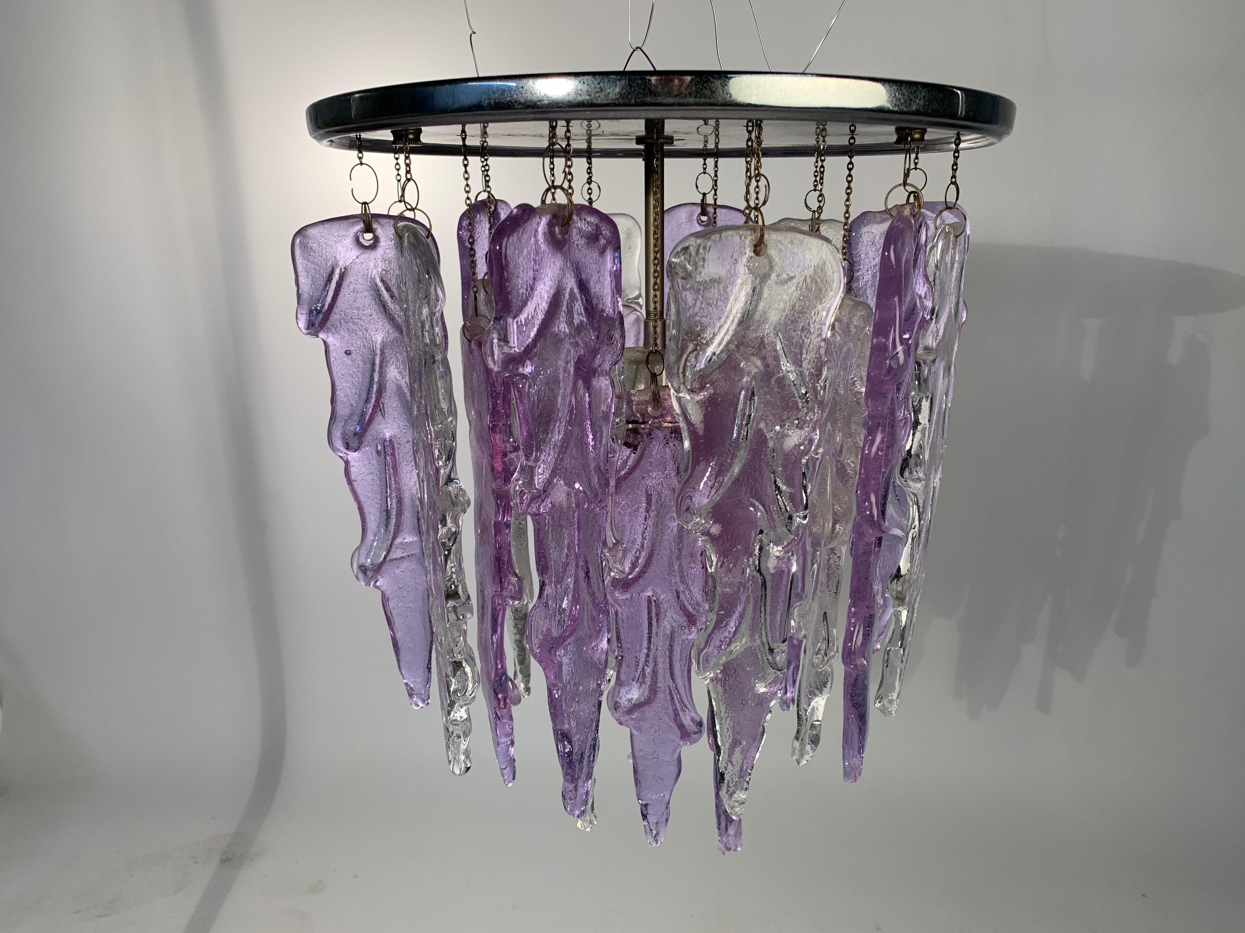 A stunning 1970s Mazzega, Italy flush mount ceiling light having Murano glass in both ice and beautiful lilac.
Measures: Height is 17” diameter is 12.5”
(We have 2 of these available. They are identical.).