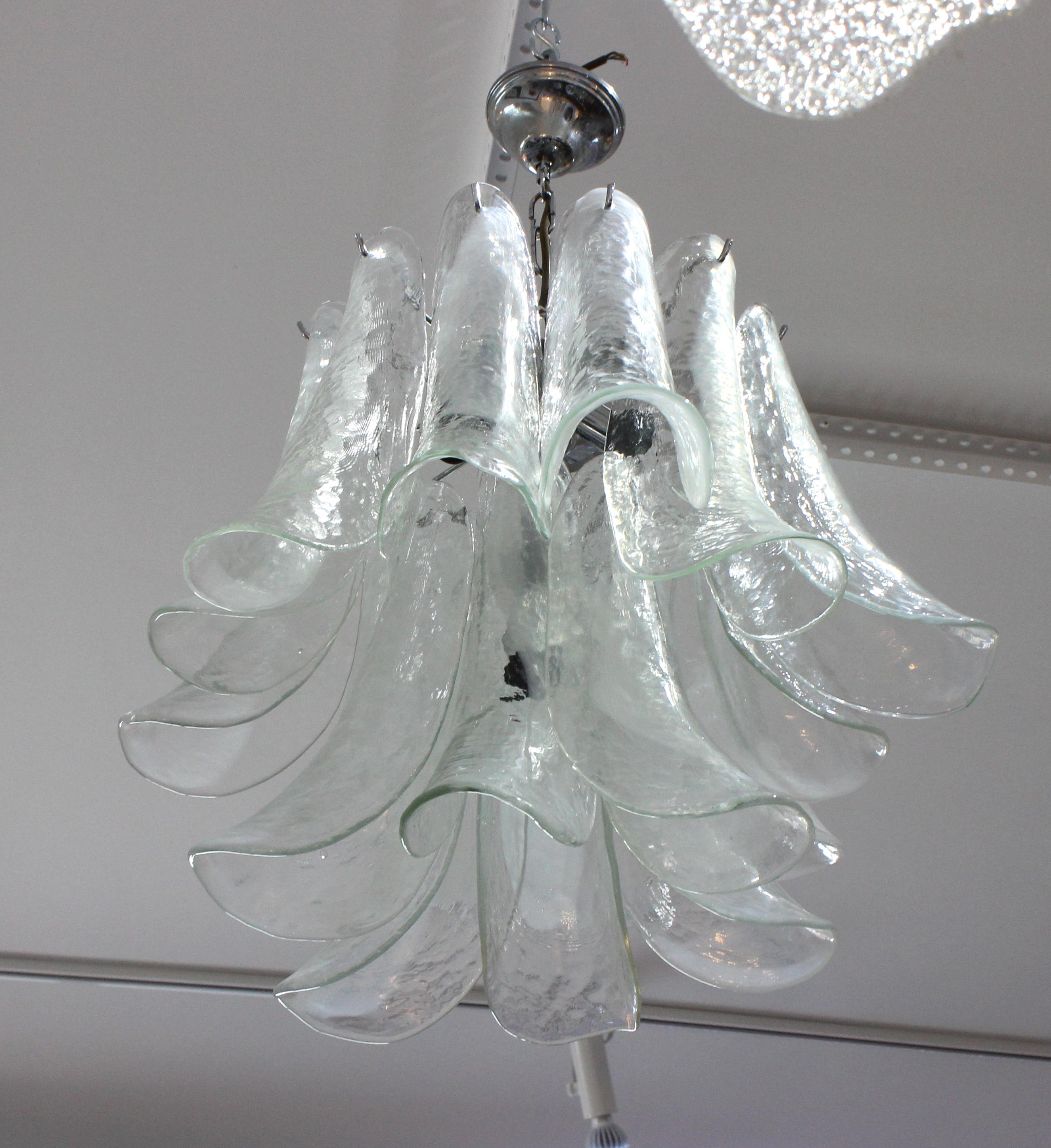 This stylish petal-form, Mazzega Murano glass chandelier dates to the 1970s and is very much in the manner of pieces created by Carlo Nason and Novaresi.

Note: Overall height is 27