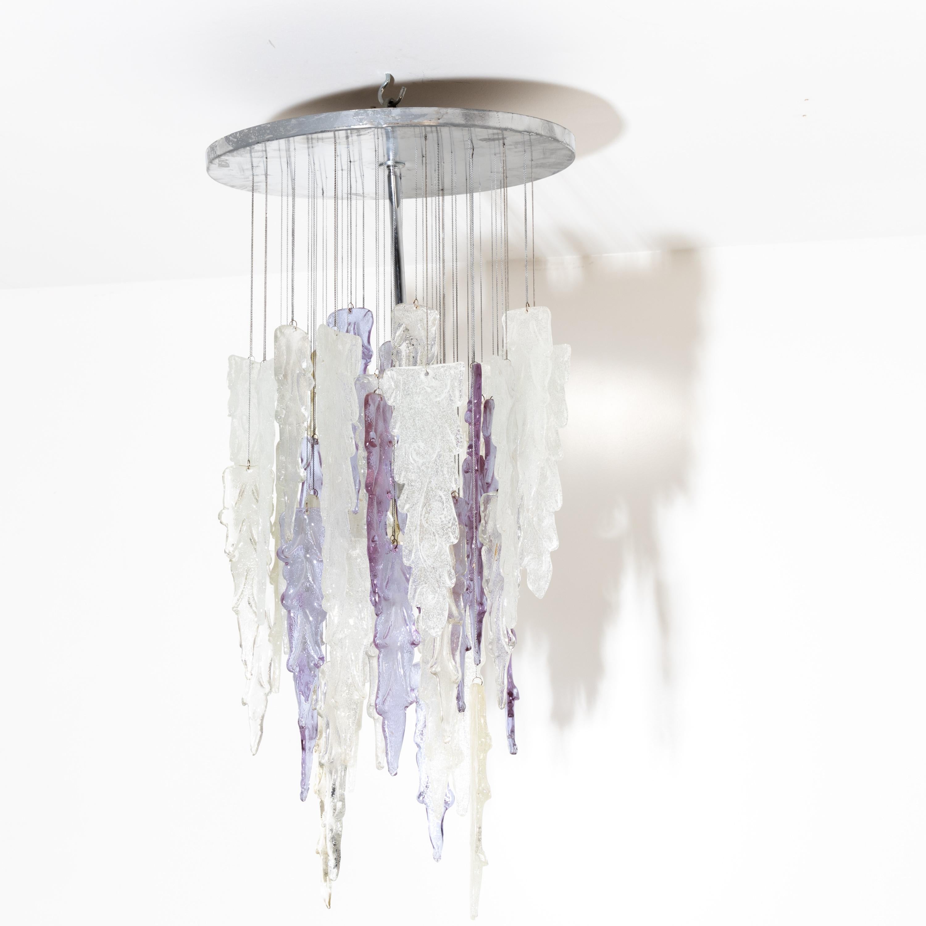 Large Mazzega chandelier with icicle-shaped glass hangings in transparent and violet glass.