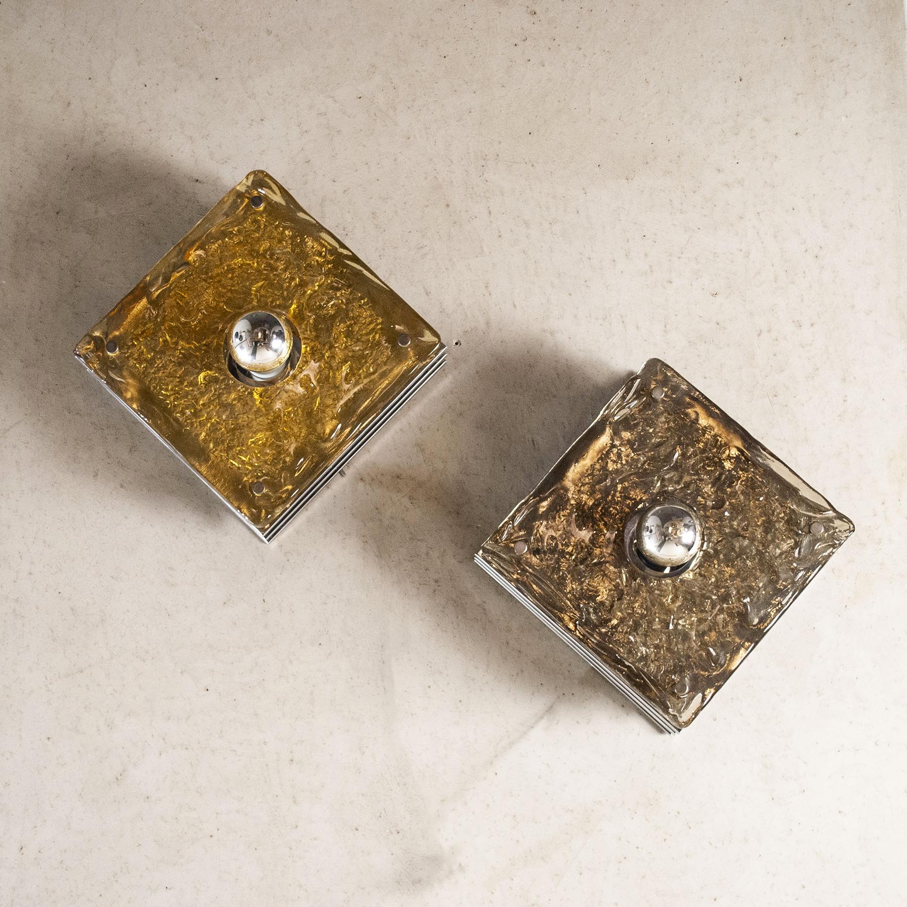 Pair of sconces structure in steel and glass worked in amber and transparent in the Mazzega style, production of the 70s.