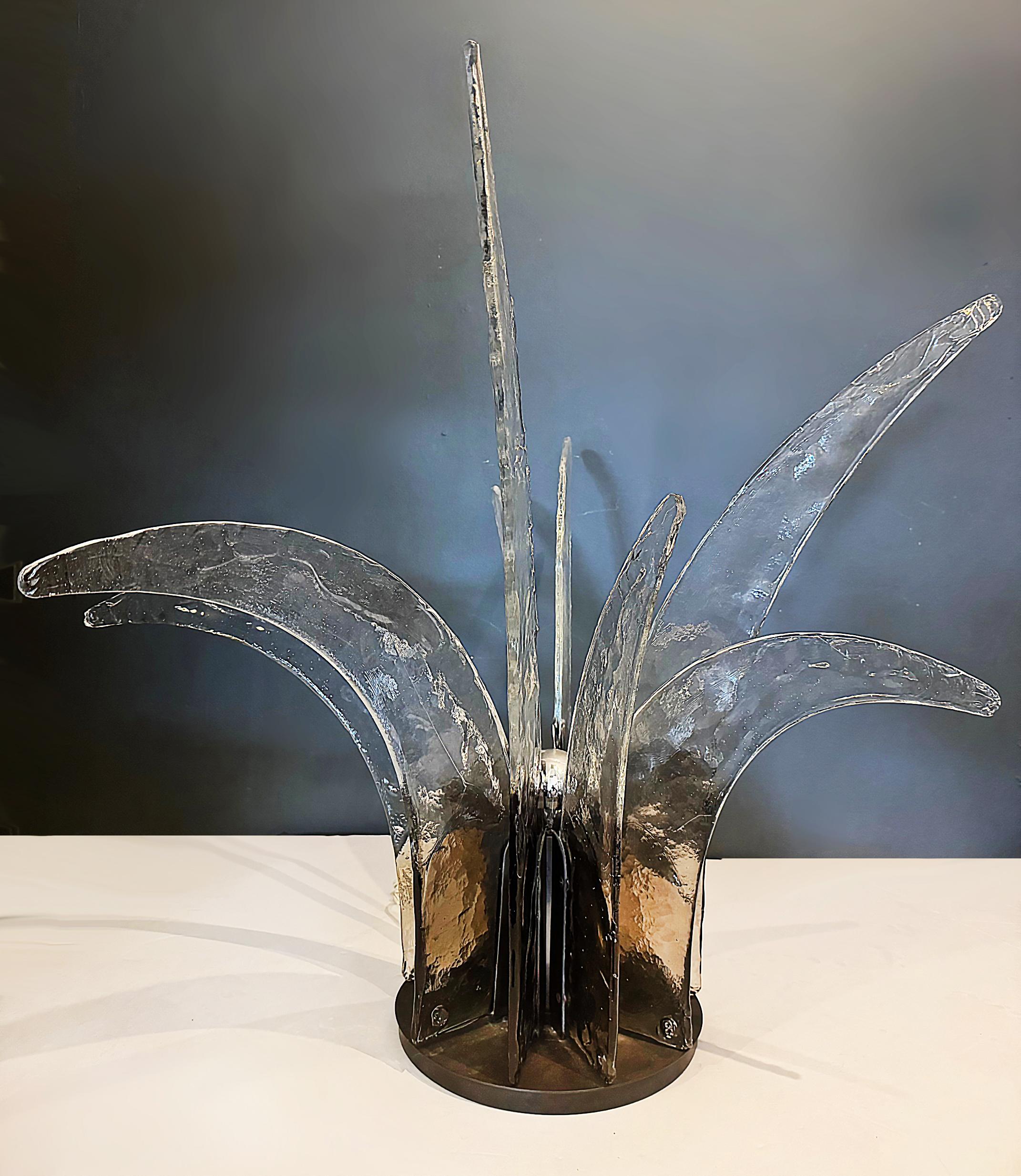 Mazzega Lampara LT 365 da tavolo Table Lamp Sculpture, Circa 1970

Offered for sale is a  Mazzega Company Italian lamp - Lampara LT 365 da tavolo - from circa 1970.  The lamp features hand-blown Murano glass in a distinctive sculptural form,