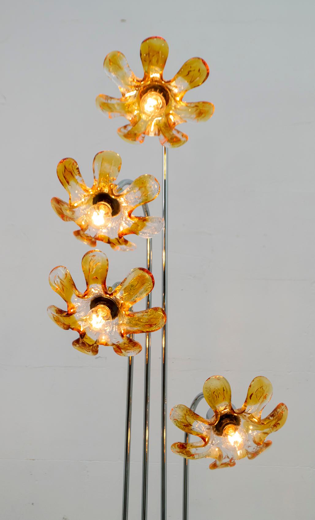 Italian floor lamp made by the famous Mazzega company in glass and chromed metal stem. This lamp represents four beautiful flowers made of Murano glass.