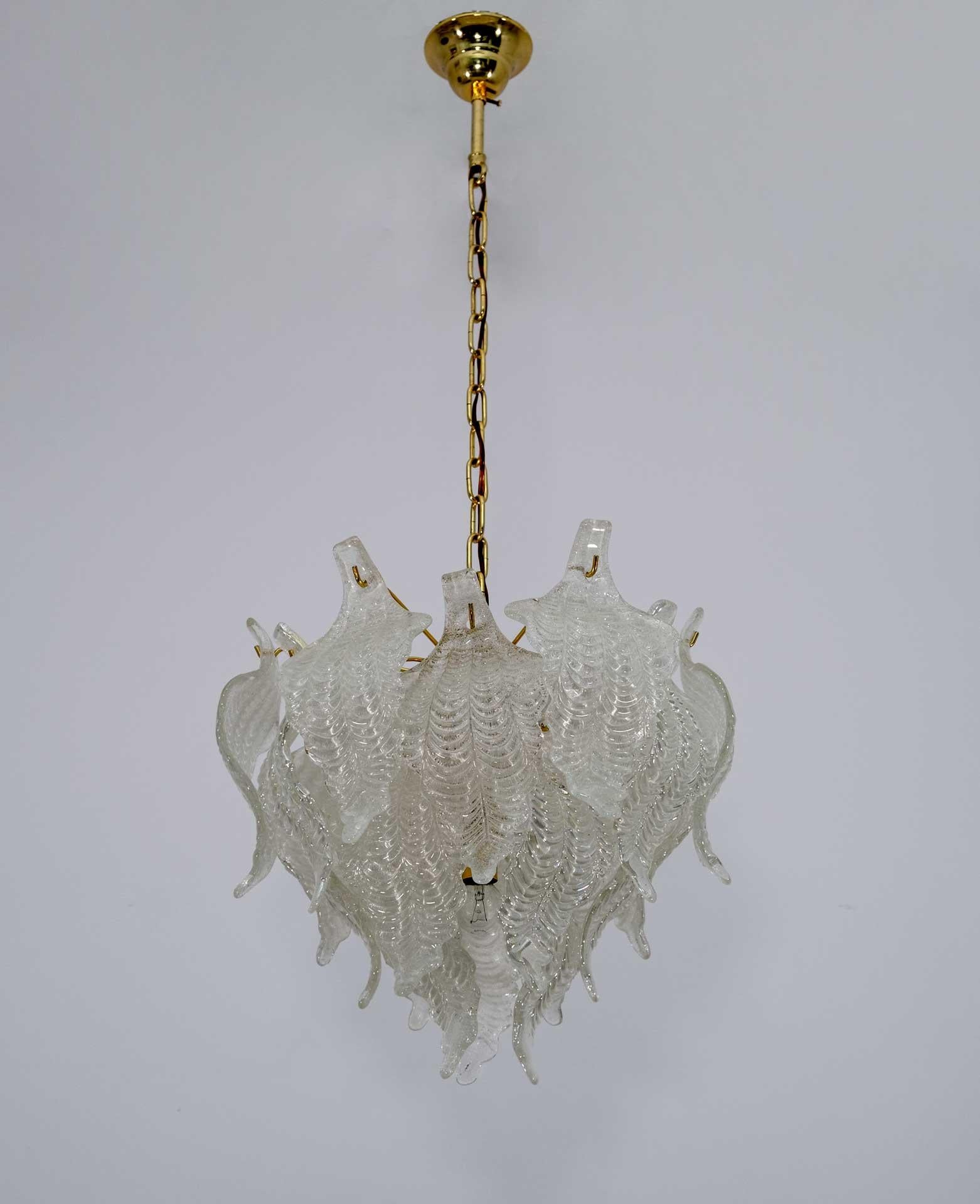 Exceptional Mazzega chandelier with Murano glass leaves with golden brass structure, 4 lights. The design and the quality of the glass make this piece the best of Italian design.