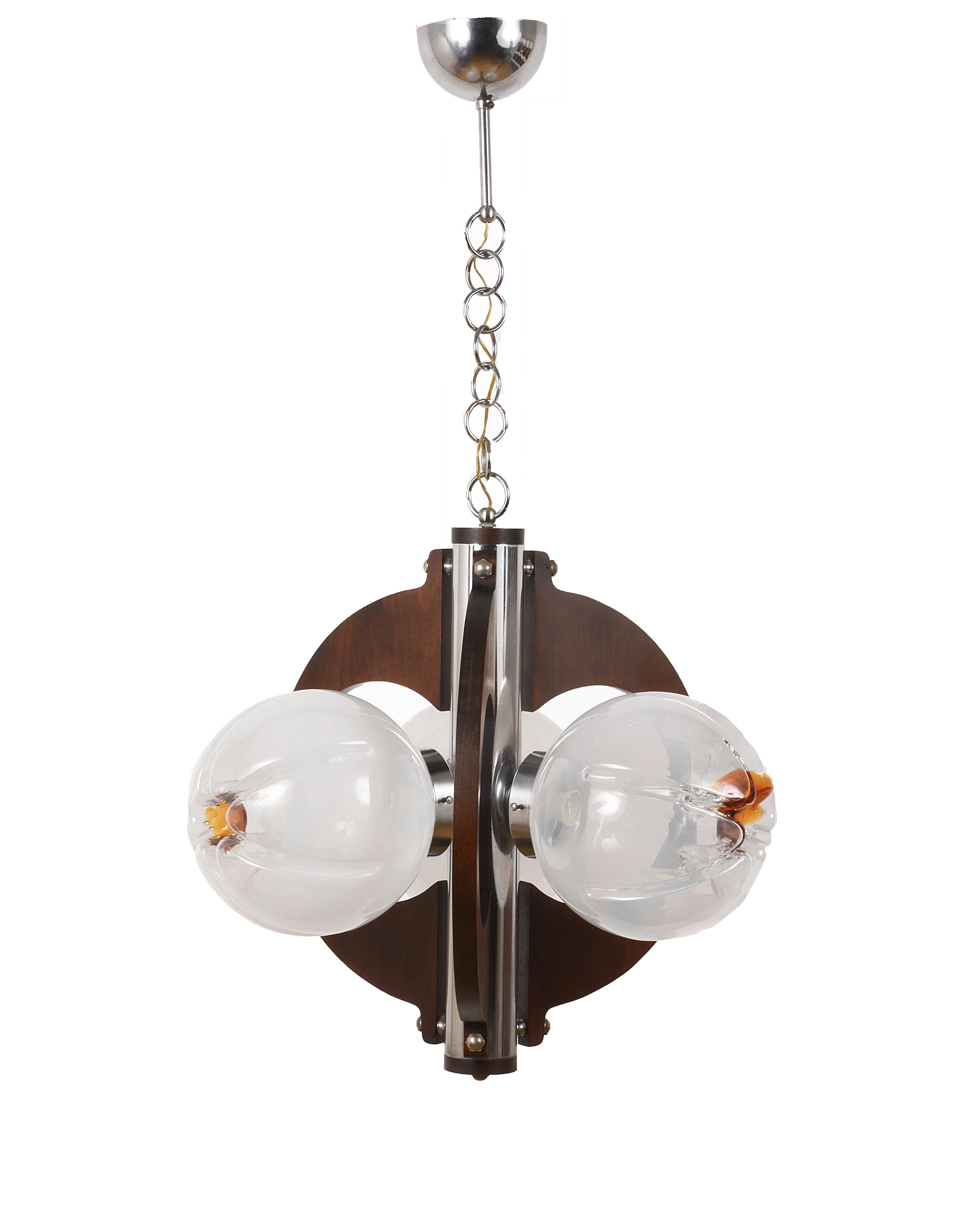 Large and elegant vintage chandelier by Italian designer Mazzega, with its famous hand blown glass globes from artistic white to amber. Three Murano glass spheres.