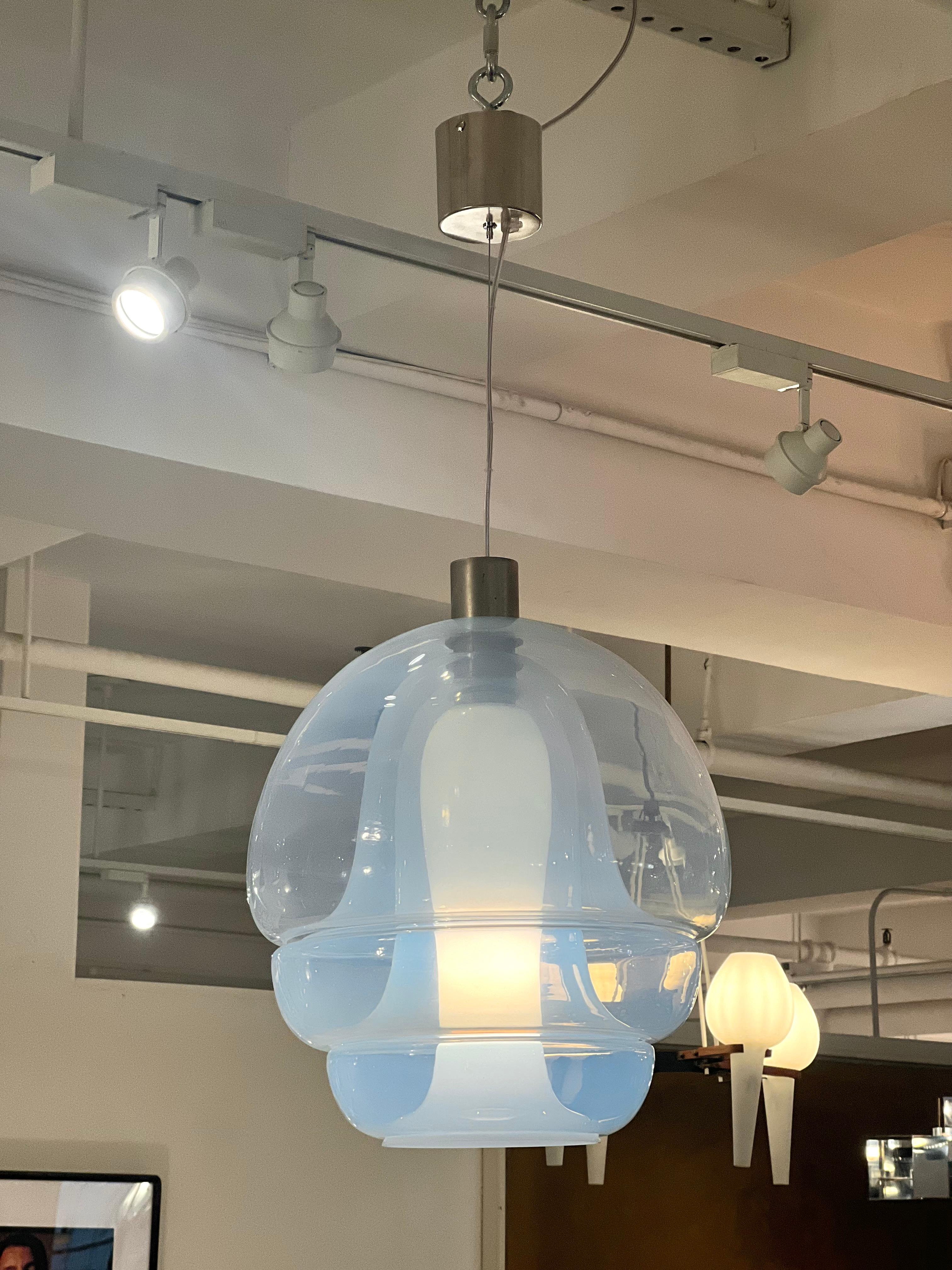 Mazzega multi layered round pendant with opalescent glass and chrome hardware. Italian, 1960's.
The overall drop is adjustable.  Drop as shown in the photos: 36