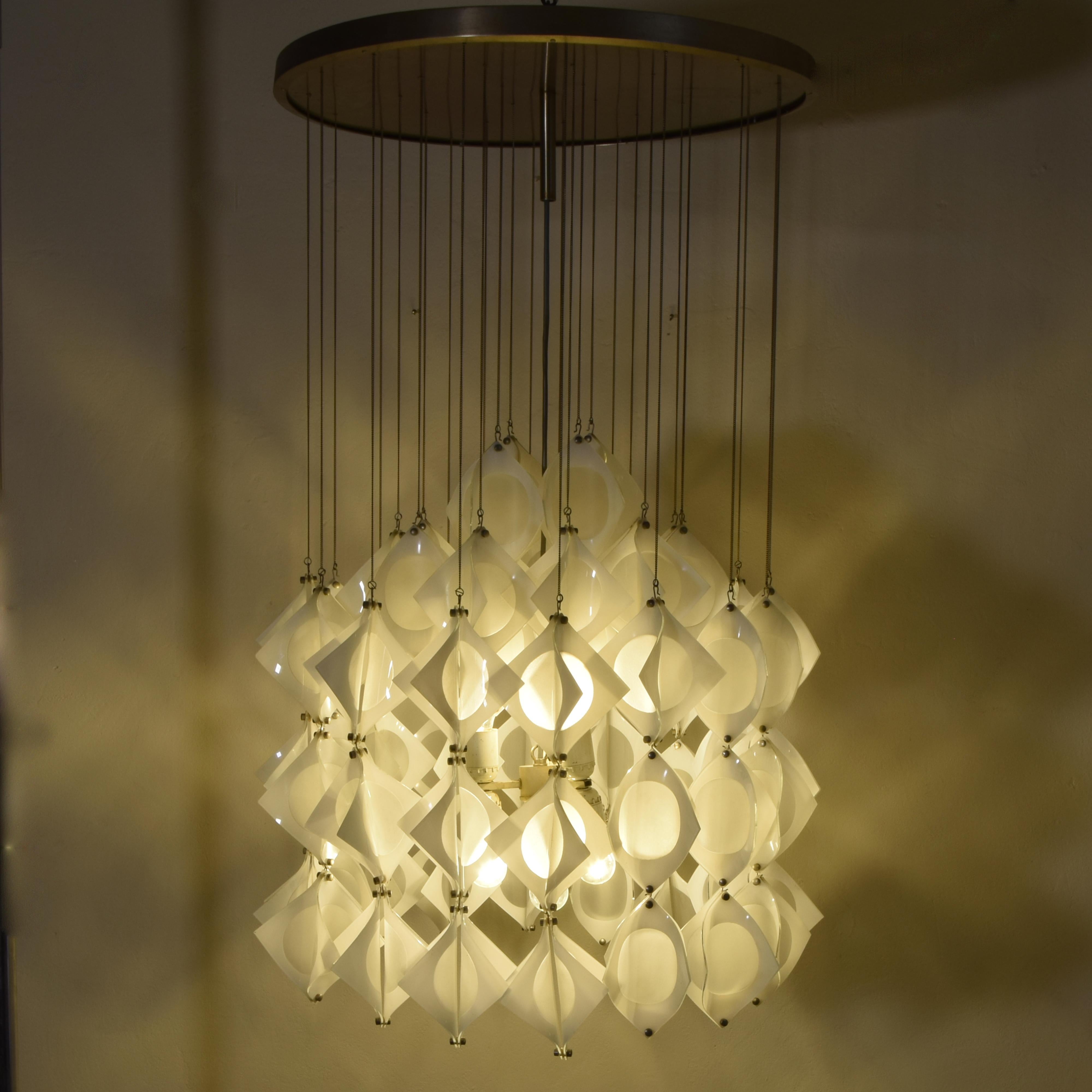 Chandelier in opal glass curved and acid etching processing inside each elementa. An Italian production Mazzega Murano glass in late 1960s.
In the international panorama of 