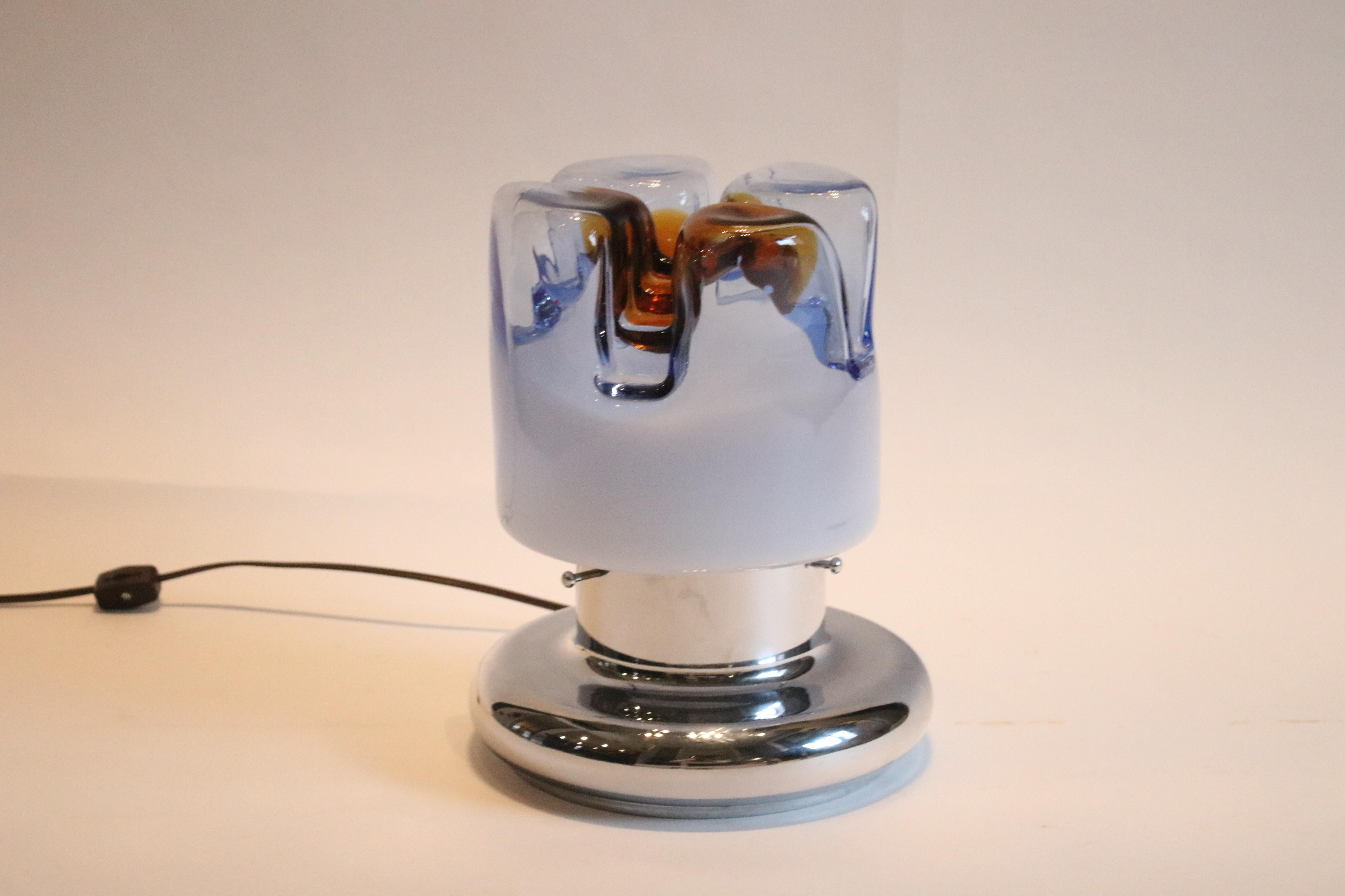 Vintage glass blown table lamp by Mazzega Glass Factory, Murano Italy, Late 1960's- early 1970's in blue and amber on a chrome base. Rewired for US with a cord switch.
