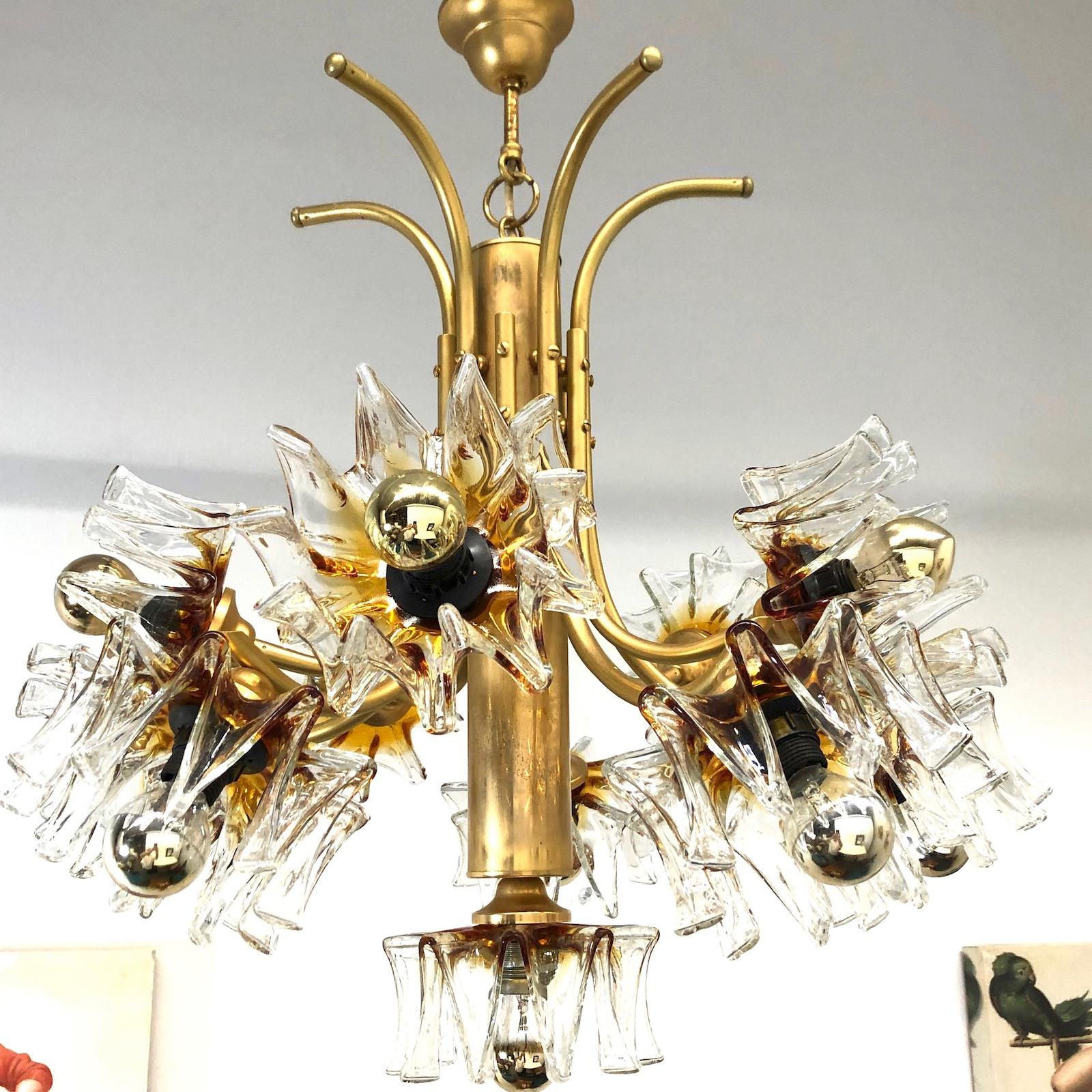 Very rare and beautiful chandelier. Made by Mazzega, Italy, 1970s. The Chandelier requires eleven European E14 candelabra bulbs, each up to 40 watts. It is tarnished and in as found condition, after polishing it is a real treasure and gives any room