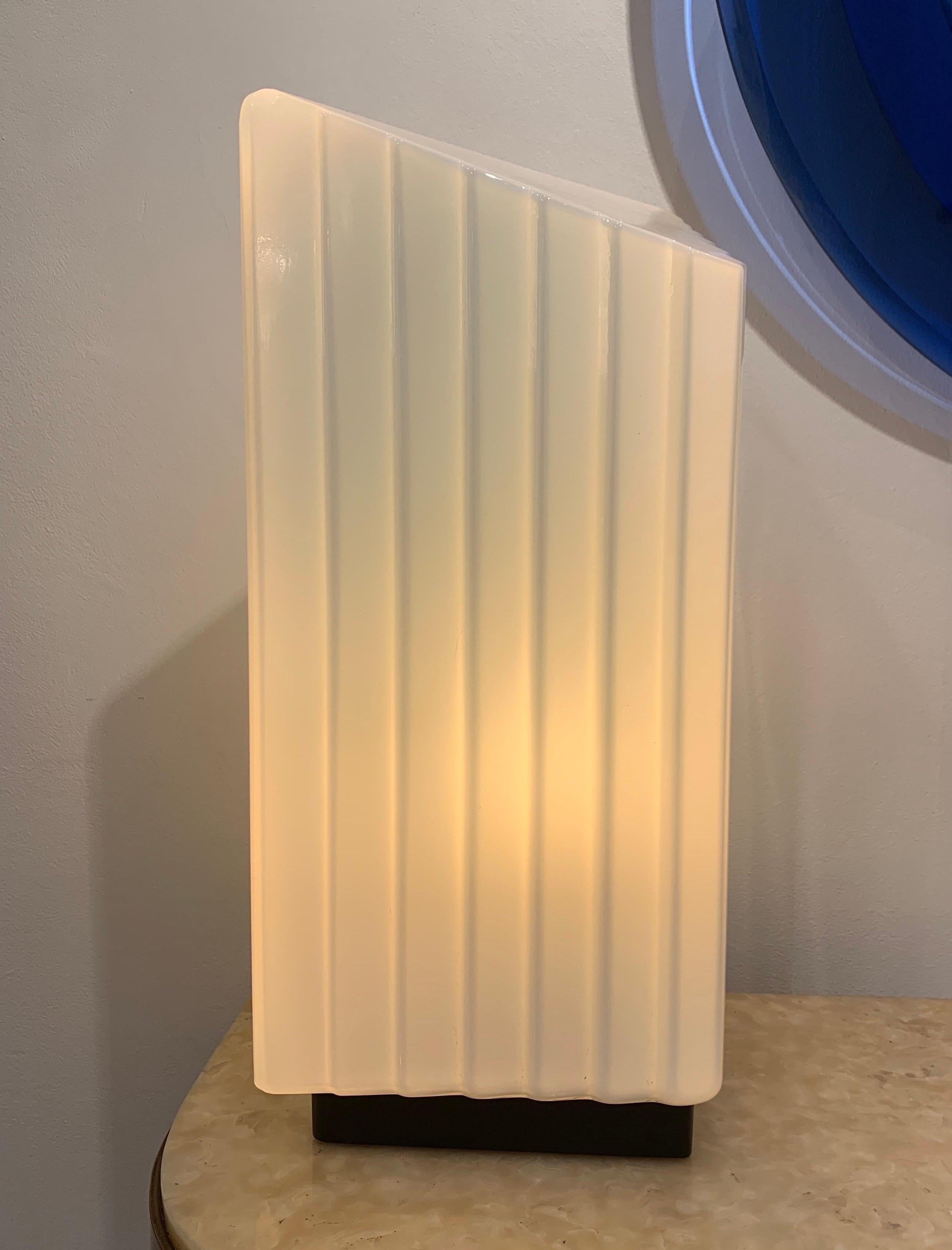 Mazzega is a Murano Glass company founded in 1946. They created design piece of glass, mainly lighting piece with a touch of avant gardiste creativity. The present lamp with its classical style dates circa 1980s.