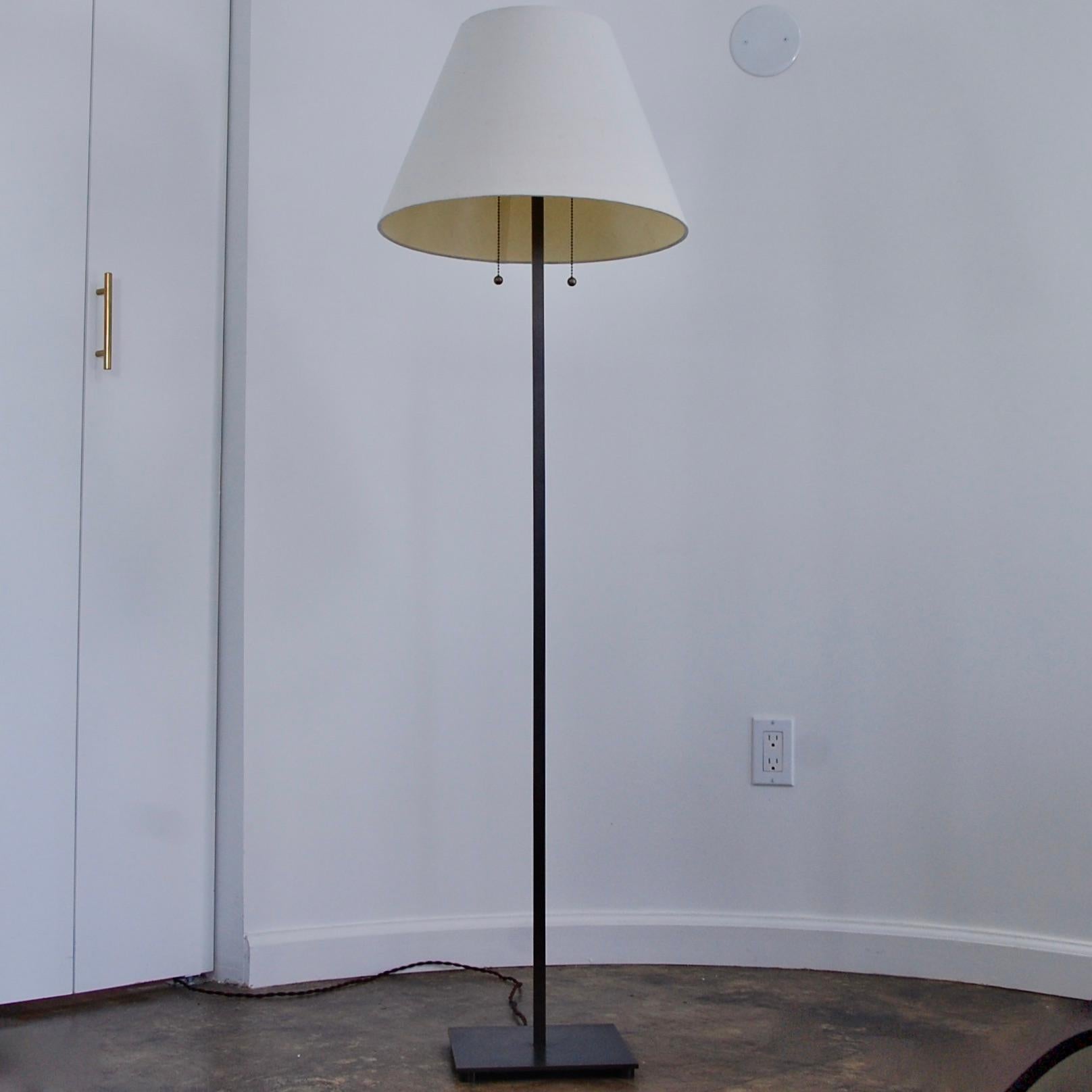 Elegant all-brass square-based Mid-Century Modern inspired floor lamp. Detailed with a fabric shade, two pull switches from two E26 medium based sockets. Ready to be used in the USA. Comes in (2) heights: 
Finish: patinated brass.