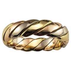 MC. Anillo de oro tricolor trenzado París 18 quilates talla 9 #18835