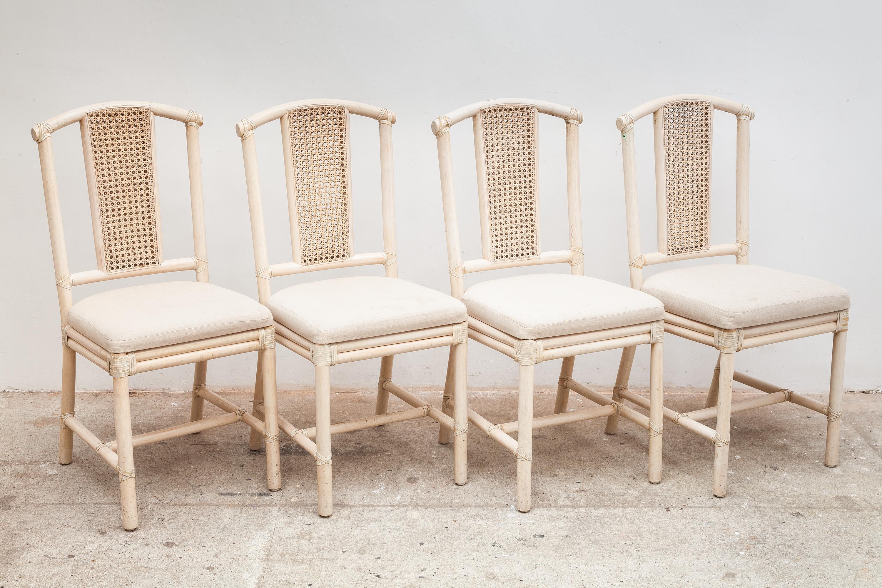 Set of 1980s bamboo and rattan set of 8 dining chairs. Two armchairs and six high back chairs. Transparent white stained frames. Water-repellent Linen cover, also for outdoor use. Dimensions: With arms 62 W x 80 H x 56 D cm, armless 44 W x 94 H x 42