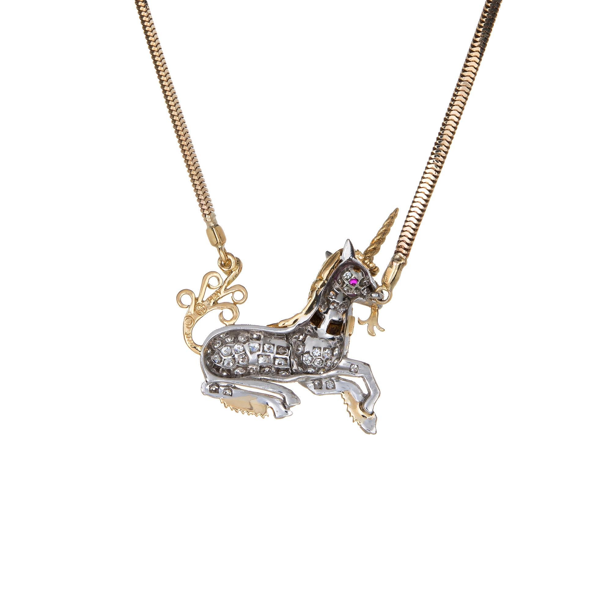 1st Installment.  Finely detailed vintage Mc Teigue unicorn necklace crafted in 900 platinum and 18k yellow gold and 14k yellow gold (chain). 

Diamonds are pave set into the mount and total an estimated 0.50 carats (estimated at G-H color and VS1-2
