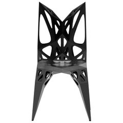 Chaise MC15 de série, à la forme sans fin, en acier inoxydable, noir et argent