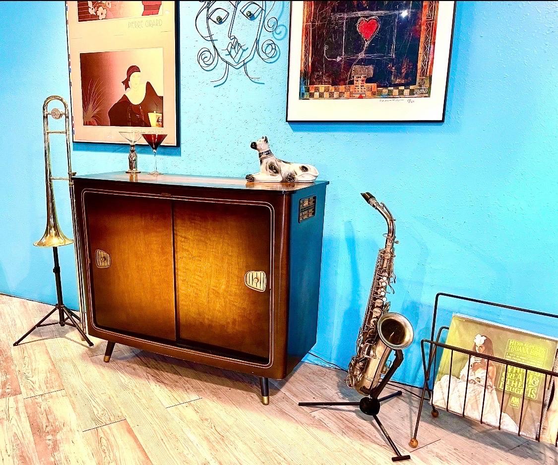 Thanks for looking at this refurbished, fully functioning midcentury stereo console.

This is a German Fonovox cabinet. It shows great time period patina but refinished to a great looking piece. The tubeset receiver is left intact and is non