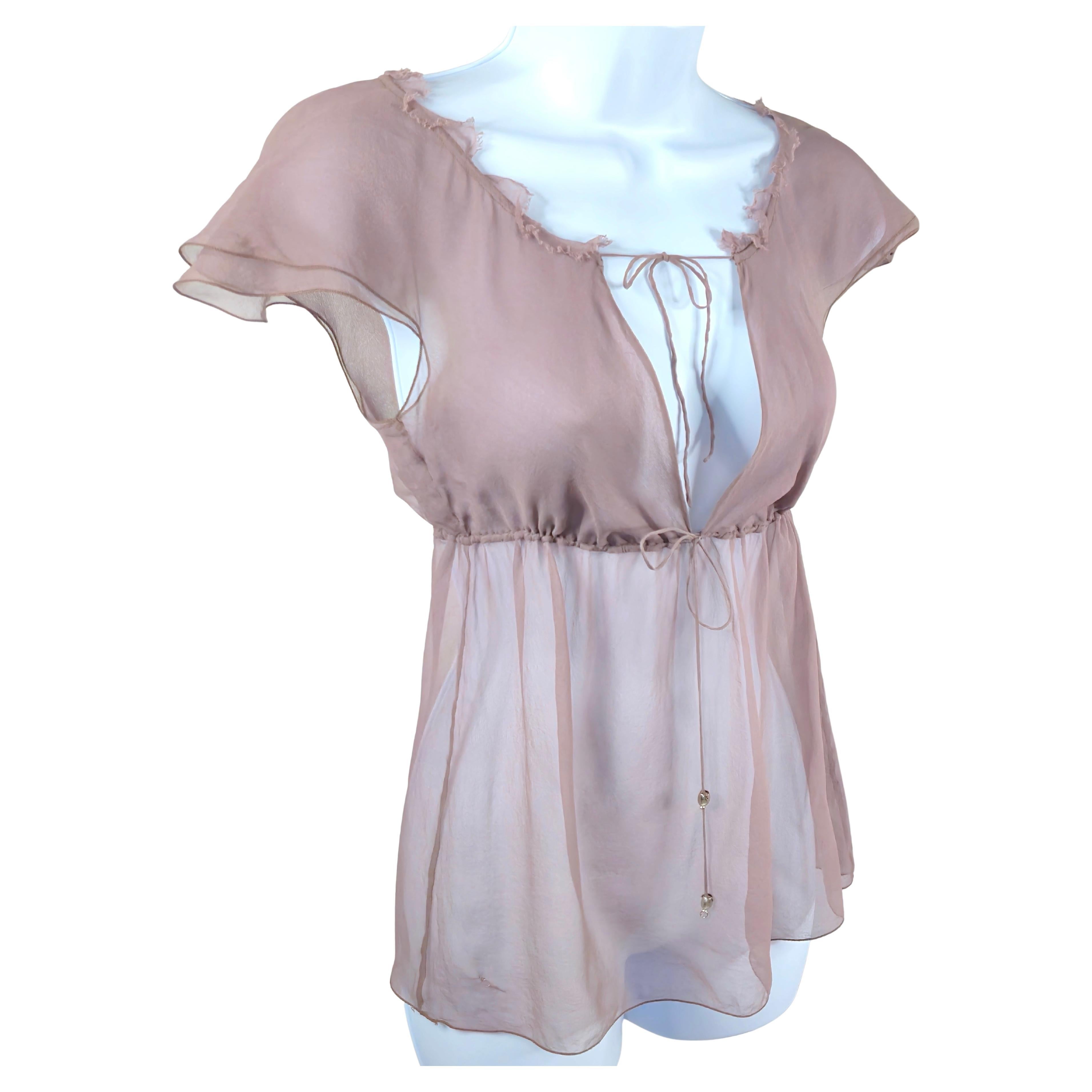 For her eponymous brand's second collection for Fall/Winter 2002, British Stella McCartney designed this airy layered silk-chiffon empire-waist cap-sleeve rose-color pullover blouse, which was a creative contemporary take on French Napoleon-period