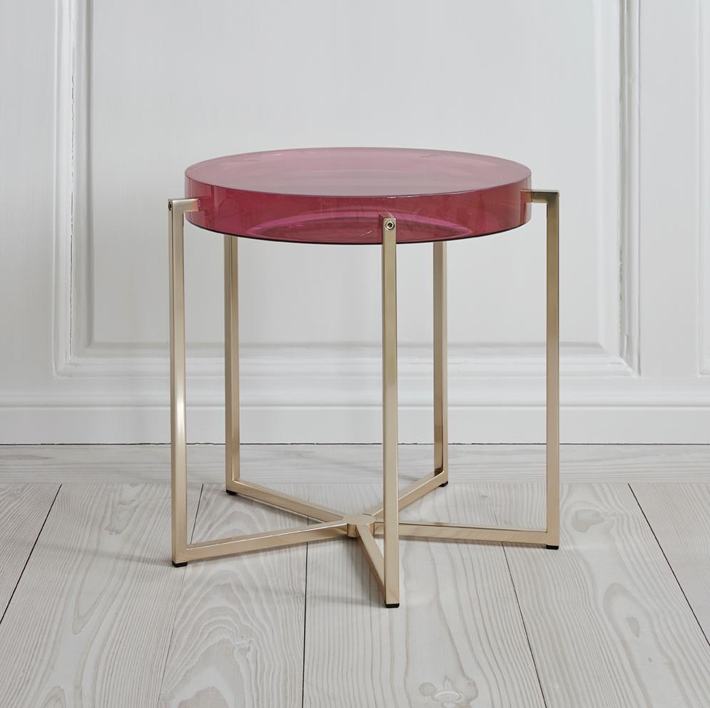 McCollin Bryan lens table with bubble gum resin top backed by acrylic mirror on brass base with five legs.

Don McCollin and Maureen Bryan set up McCollin Bryan in 1998. The fusion of their backgrounds in textiles (McCollin at the Royal College of