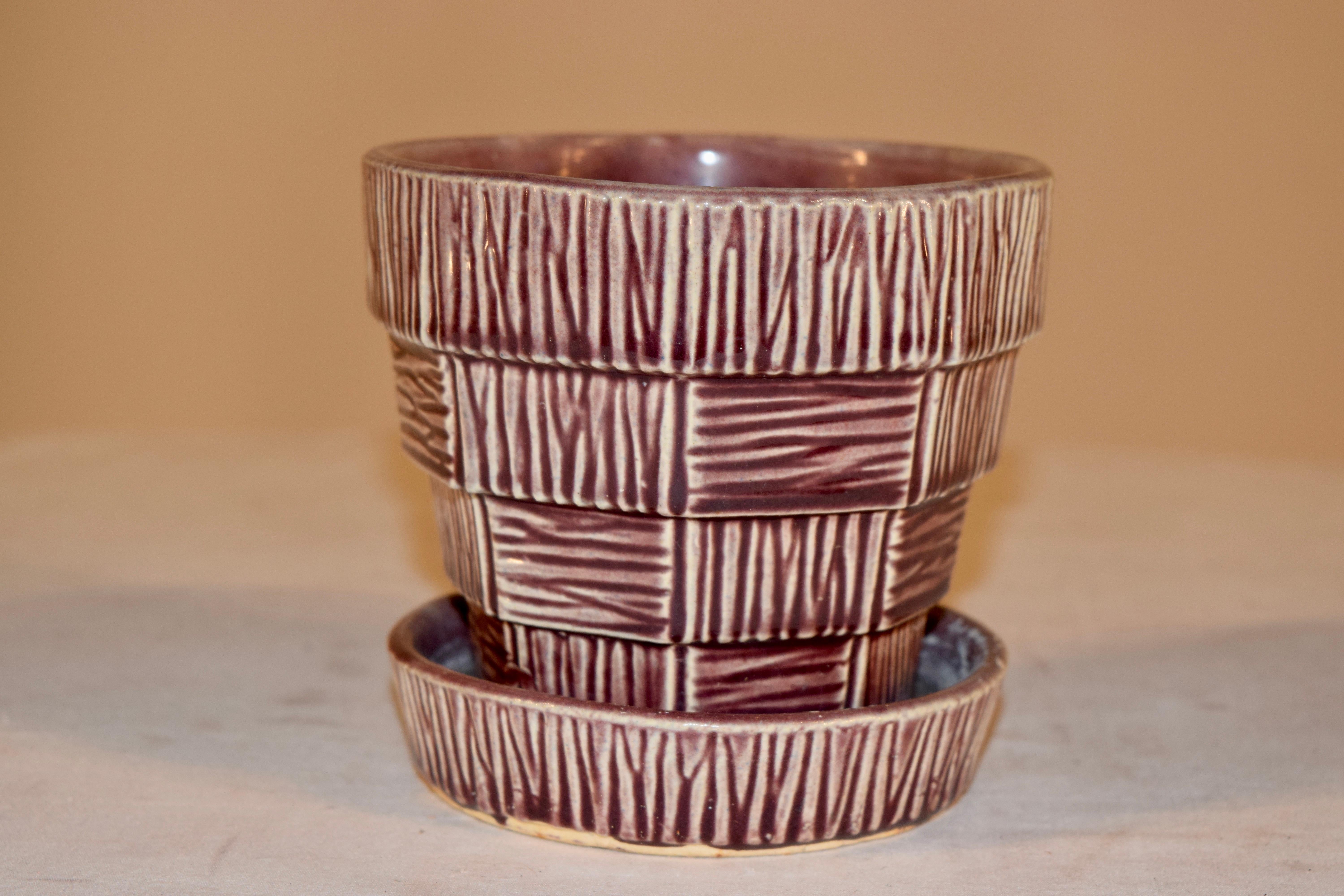 McCoy Pottery shape 19 purple flower pot with attached saucer. Extra spot of clay to the base edge. Bottom marked with McCoy and USA.