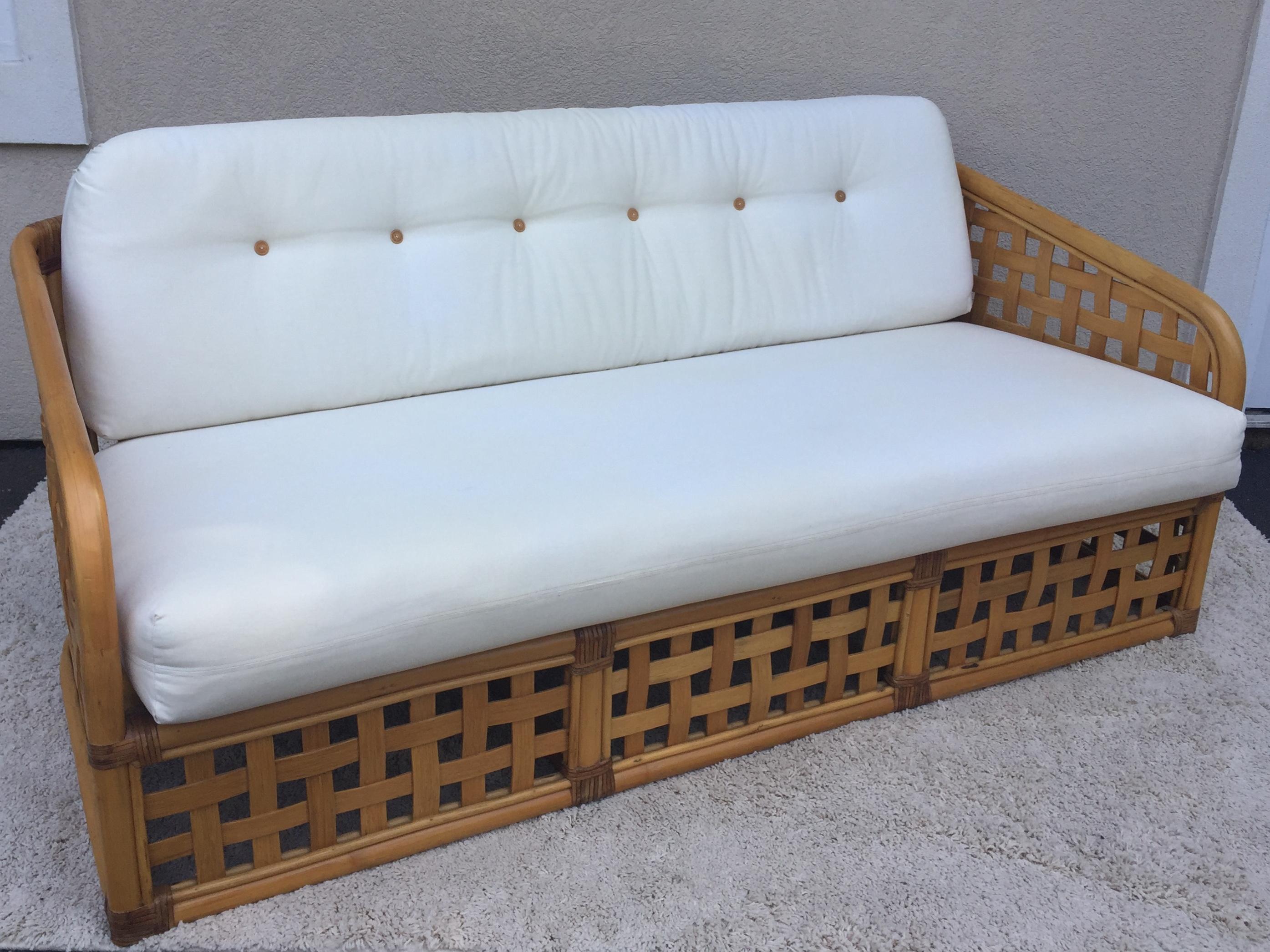 McGuire sofa, love seat, club chair and ottoman set in a square open basket design, covered in original white duck fabric, square design construction with bamboo buttons tufts.
Love seat 47''x 30''x 27'' deep 17.50 seat
Sofa 69 x 30 high x 27 deep