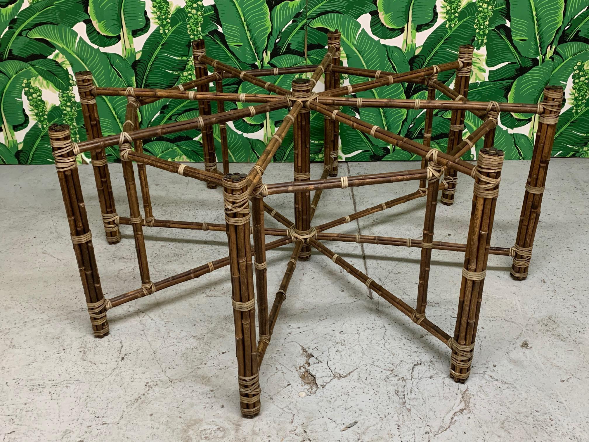 Large octagonal dining table base by McGuire features an iron frame wrapped in bamboo and lashed with leather rawhide laces. Base measures 66
