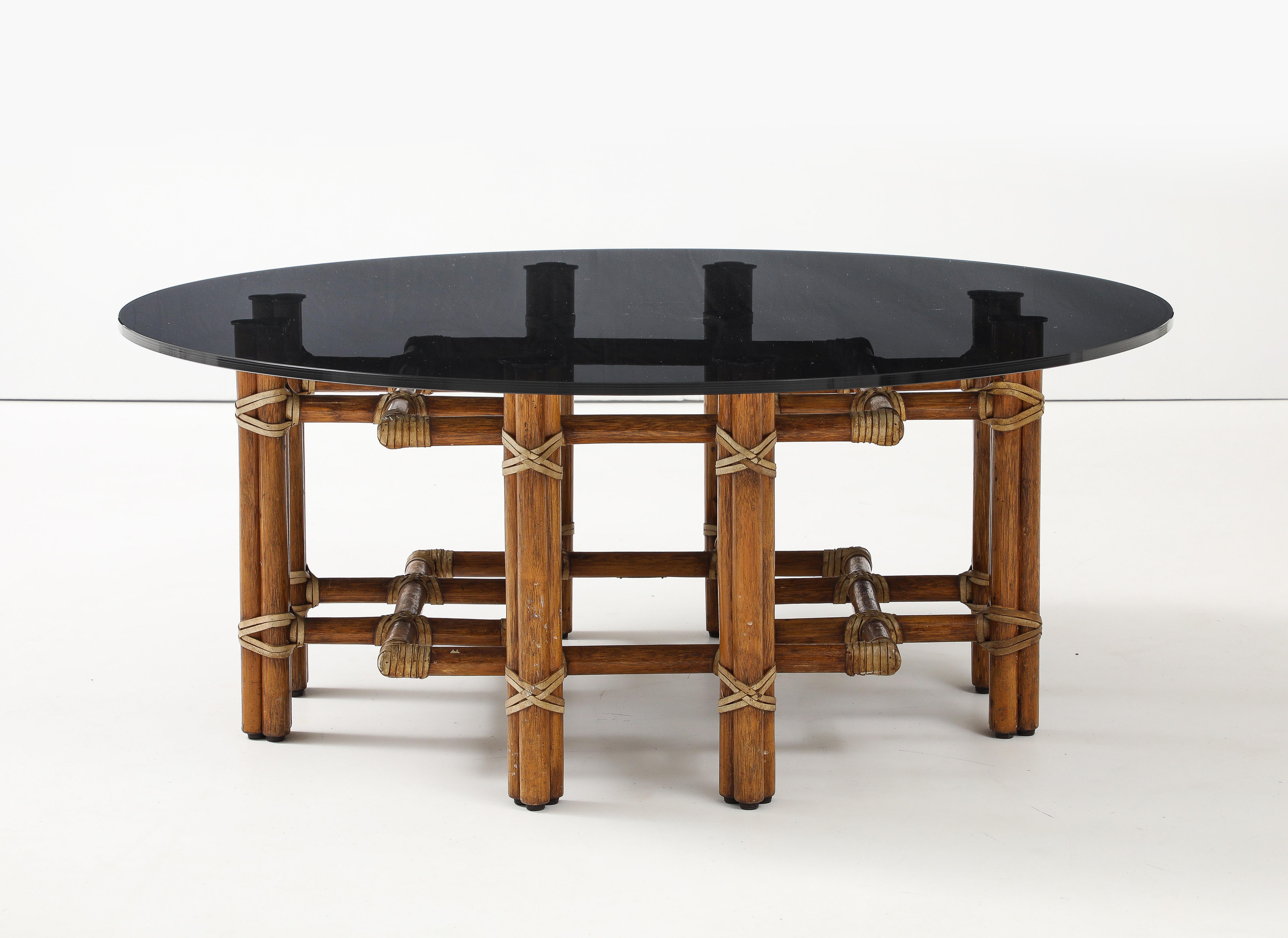 American McGuire Bamboo Coffee Table, Leather Straps, Brass and Grey Glass Round Top For Sale