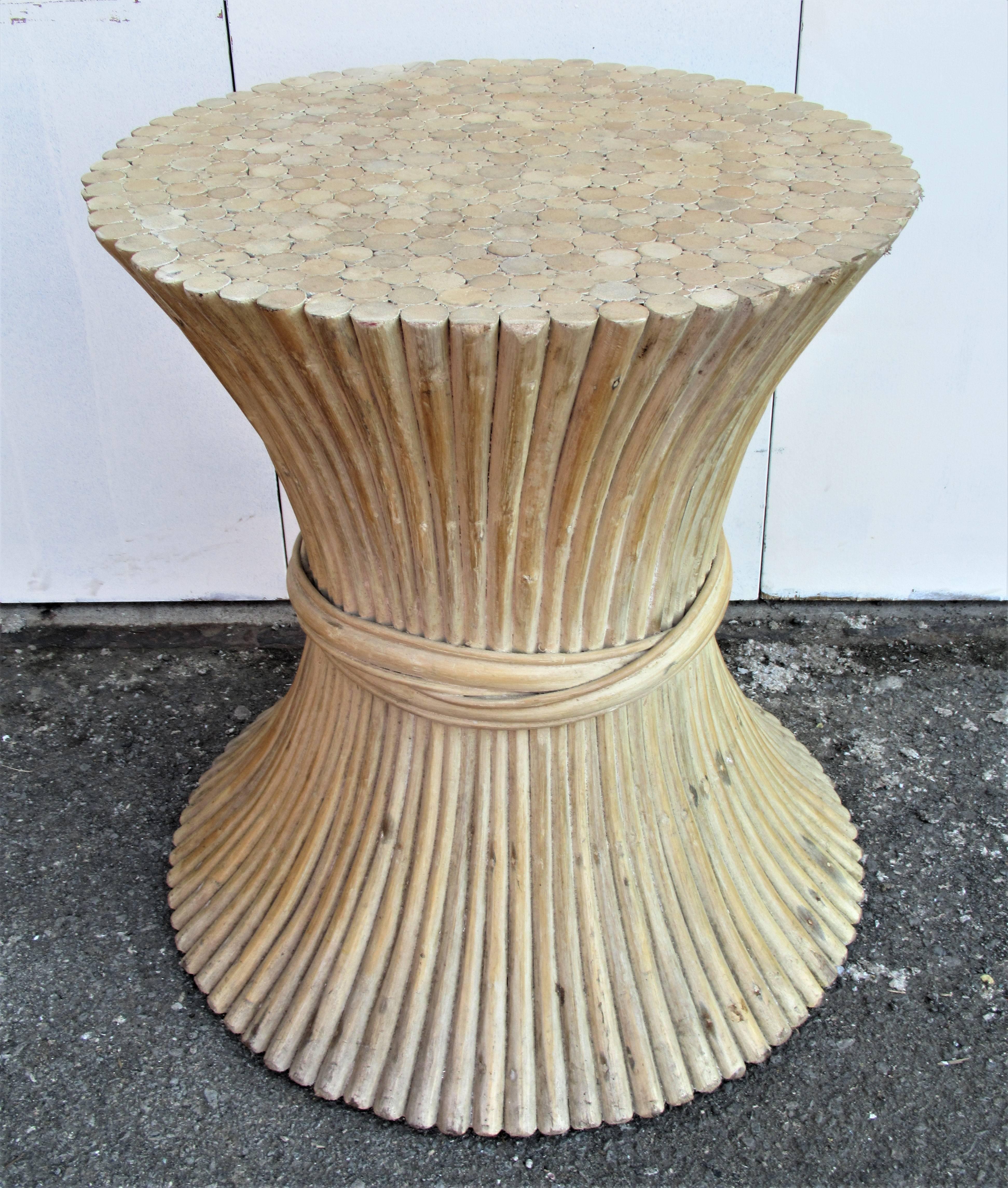Bamboo sheaf of wheat dining table base in beautifully aged very pale surface color by John and Elinor McGuire. Measures: 29 inches high x 24 inches top diameter x 28 inches bottom diameter. Can easily accommodate a large round plate glass top sized