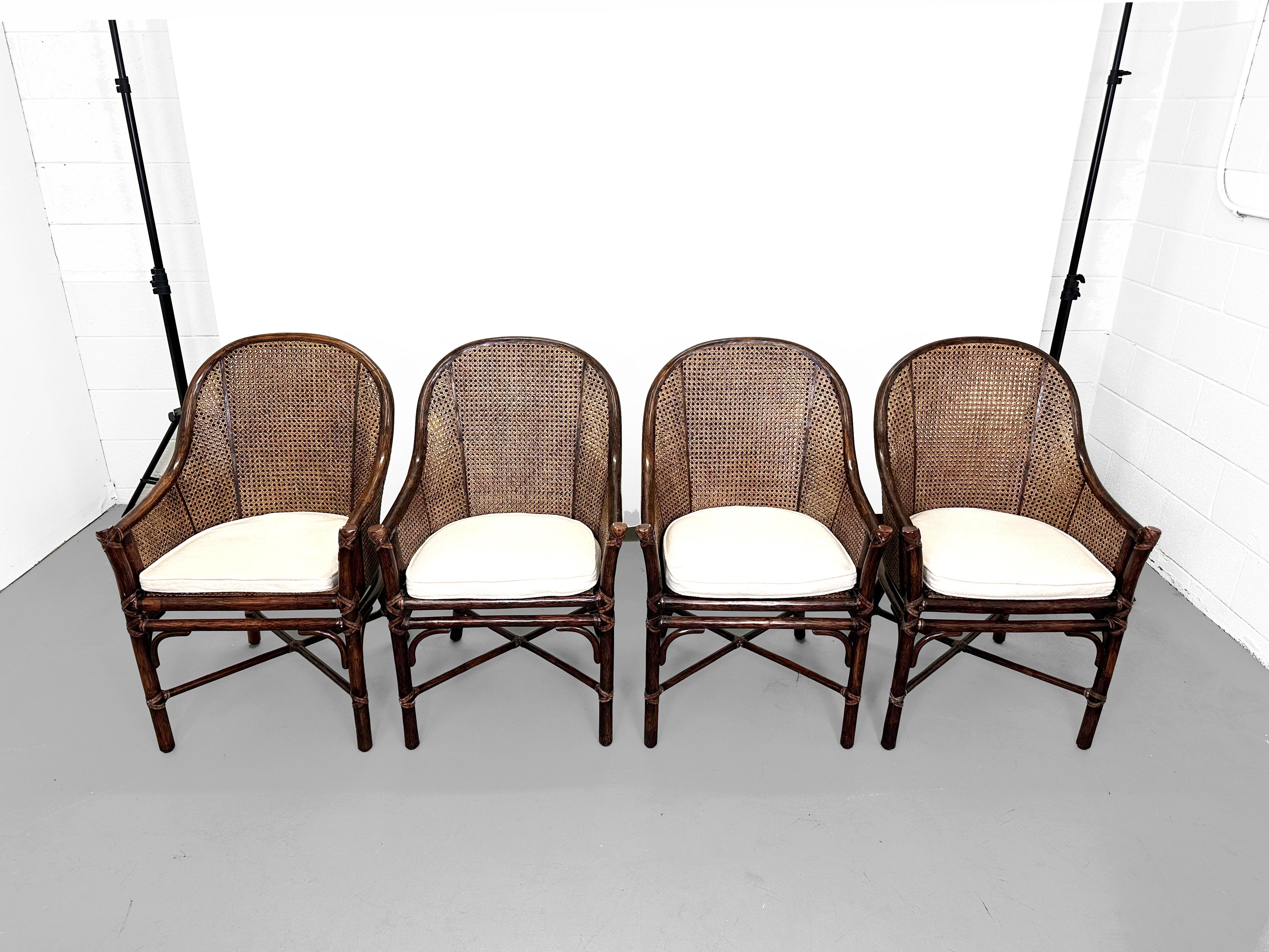 A gorgeous set of 4 Belden model dining chairs by Elinor McGuire. San Francisco, USA, 1987.

California coastal organic modern style, featuring thick rattan pole frames with a barrel back form inset with honeycomb cane on the back and sides. The