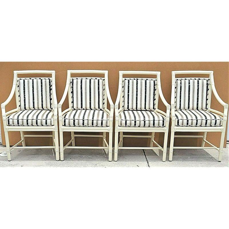For full item description be sure to click on CONTINUE READING at the bottom of this listing.

McGuire Chippendale Coastal MCM Bamboo Rattan Dining Armchairs - Set of 4
Coloration is ivory/cream.
The seat cushions are loose and the back pads are