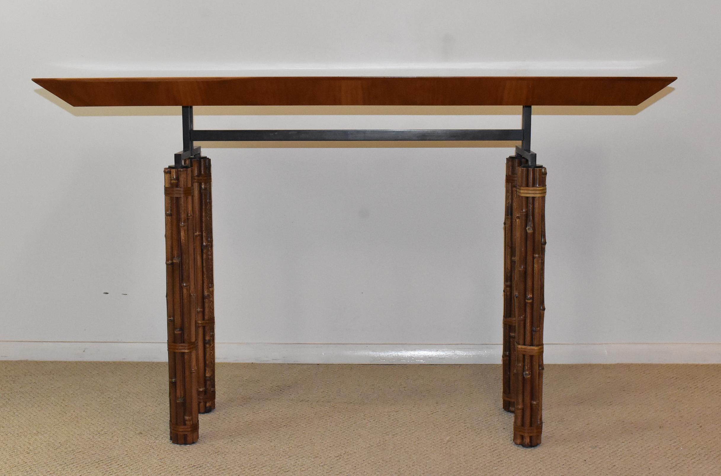 McGuire console table made of bamboo wrapped iron base with rawhide ties and a cherry wood top. Good condition. Dimensions: 18