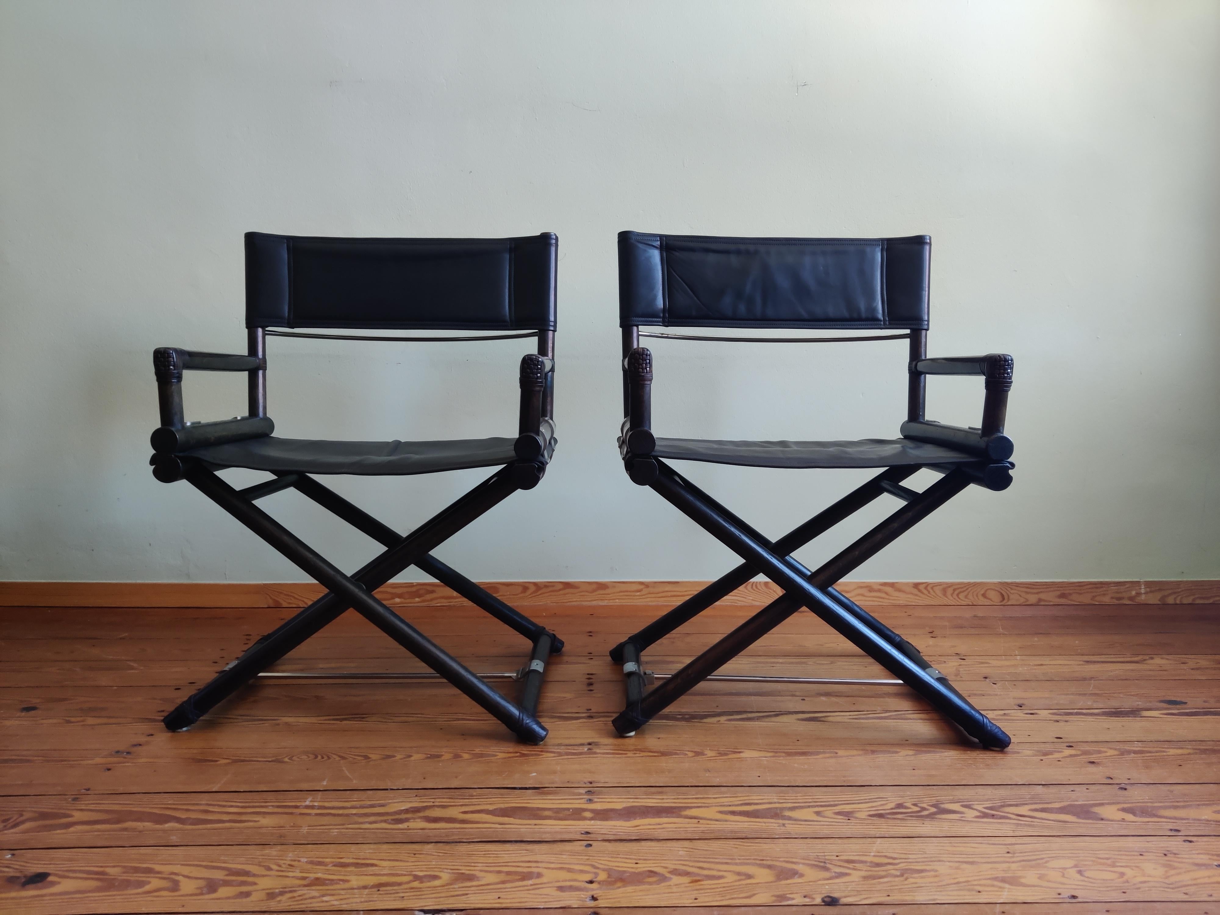 Rare set of 4 late 1950s McGuire X-Chairs in beautiful tinted oak wood, black leather and silver-chrome hardware. 
Due to the age, there are minor signs of use and fixes, but nothing that shows on first sight or affects functionality. 
The leather