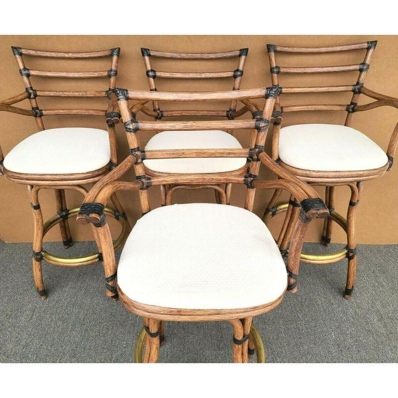 Set of 4 McGuire Mid-Century Modern faux bamboo rattan 360 degree swivel barstools

Approximate Measurements in Inches
44.5