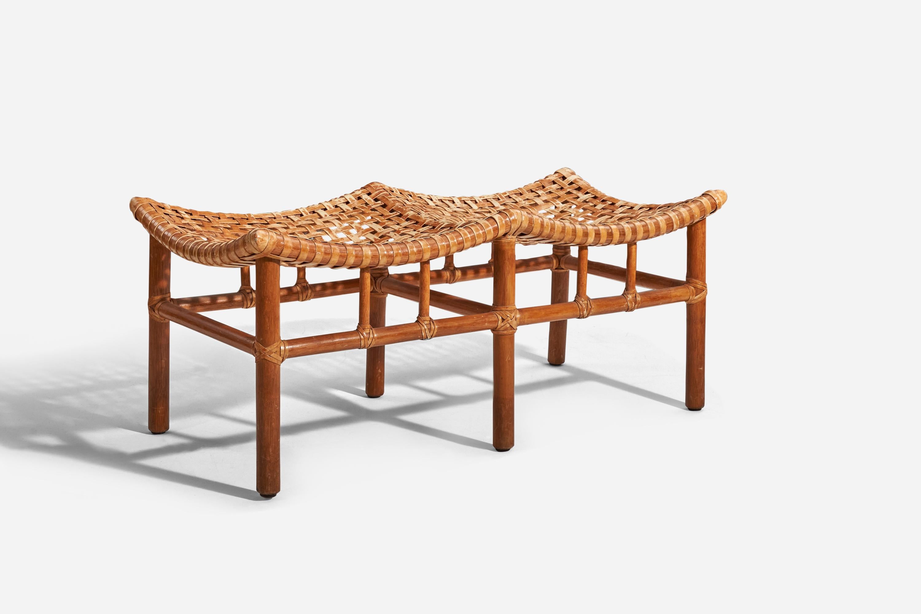 A bamboo, leather and rattan bench designed and produced by McGuire Furniture, United States, 1970s.