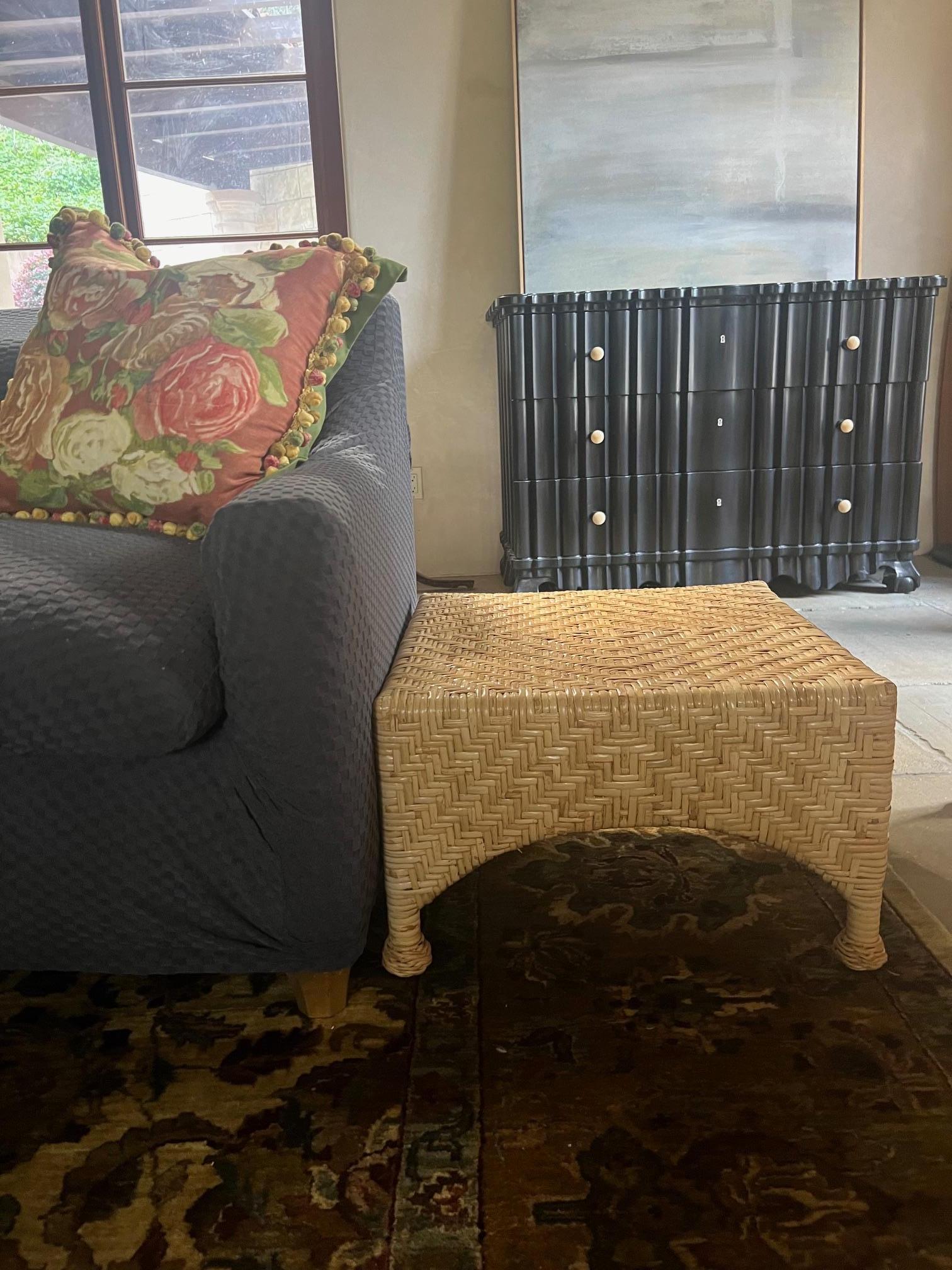Wicker ottoman or low side table by McGuire Furniture. The wicker is woven around steel making it a sturdy piece, the feet are ball design.

Furniture can always be picked up for free from me in the San Francisco Bay Area.