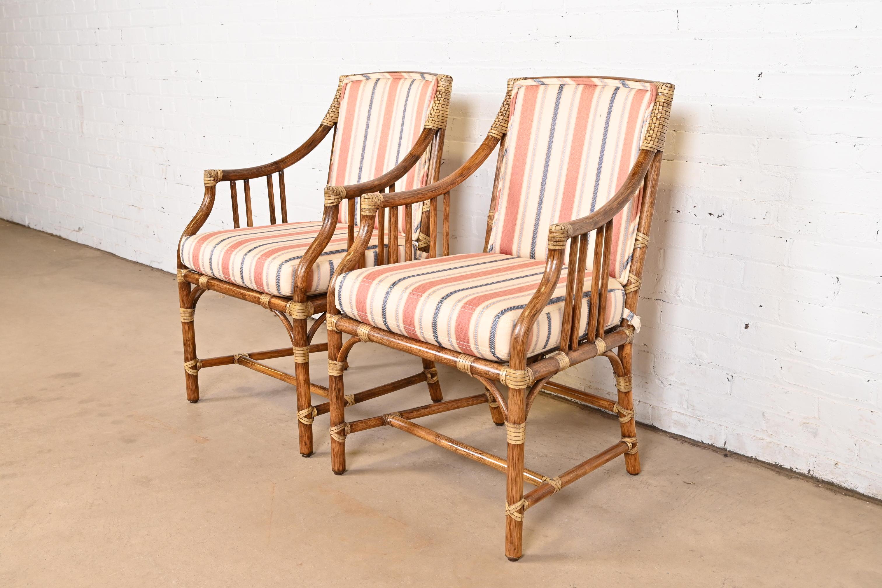 A gorgeous pair of Hollywood Regency organic modern bamboo rattan club chairs or dining armchairs

By McGuire of San Francisco

USA, Circa 1980s

Measures: 22.75