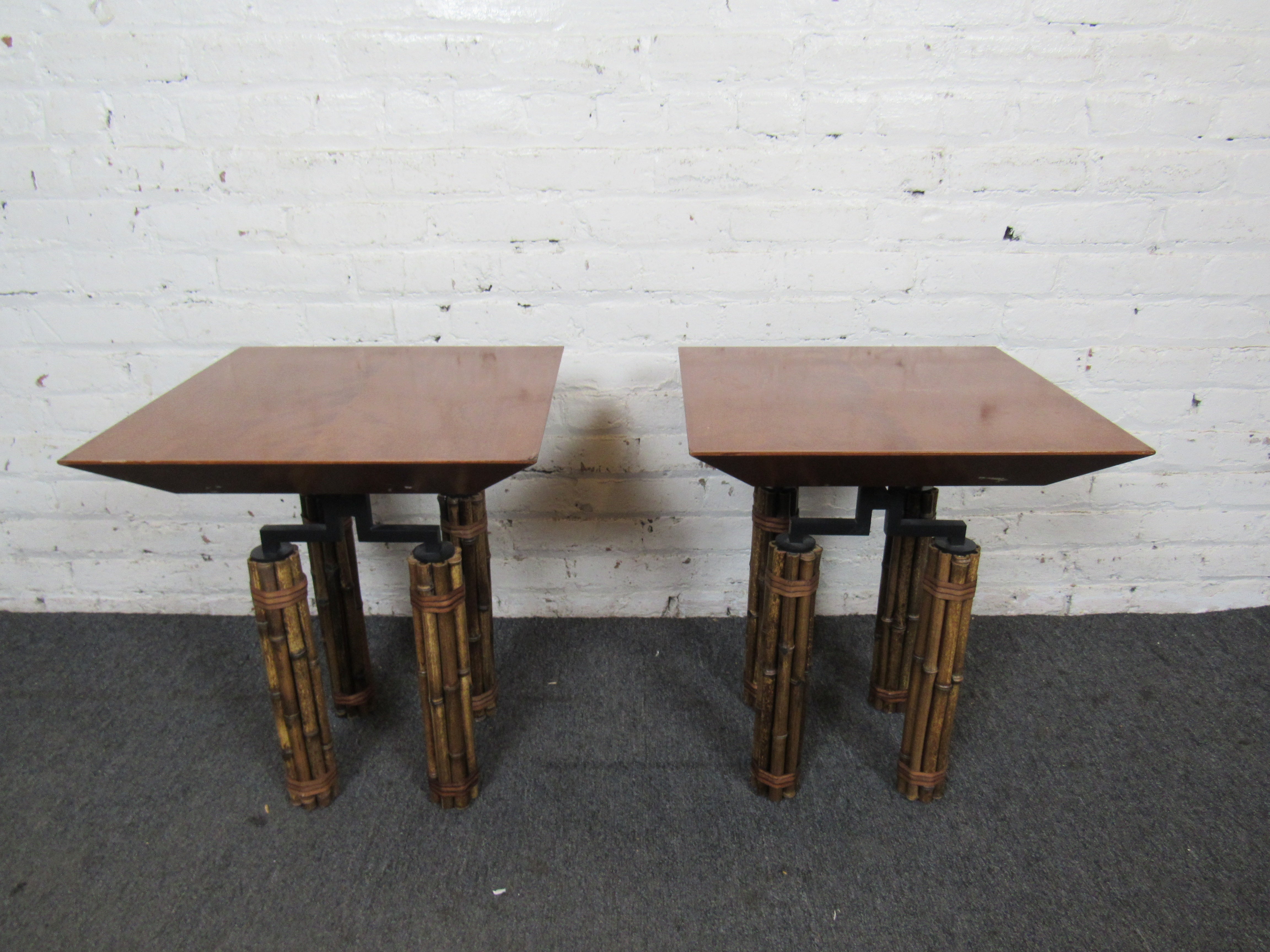 This pair of side tables by McGuire combines faux bamboo with metal, and square wooden tops for a unique look. The Huxley Series was designed by Richard Hannum.
Please confirm item location with seller (NY/NJ).