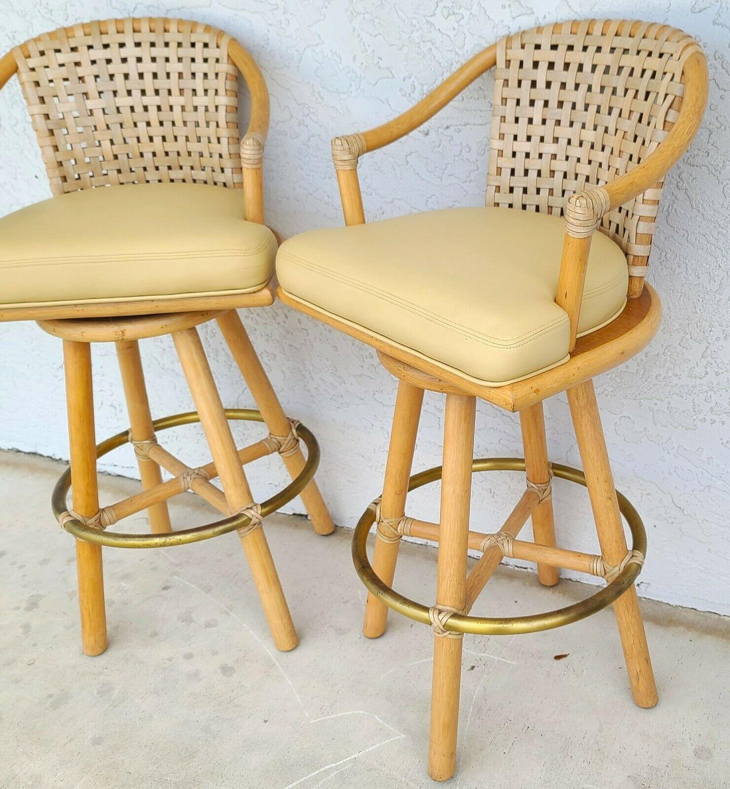 For FULL item description be sure to click on CONTINUE READING at the bottom of this listing.

Offering One Of Our Recent Palm Beach Estate Fine Furniture Acquisitions Of A
Pair of McGuire Laced Leather Cerused Rattan Swivel