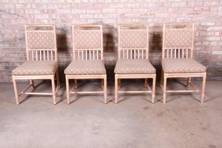 A gorgeous set of four whitewashed bamboo rattan upholstered dining chairs

By McGuire of San Francisco

USA, circa 1970s

Measures: 20.5