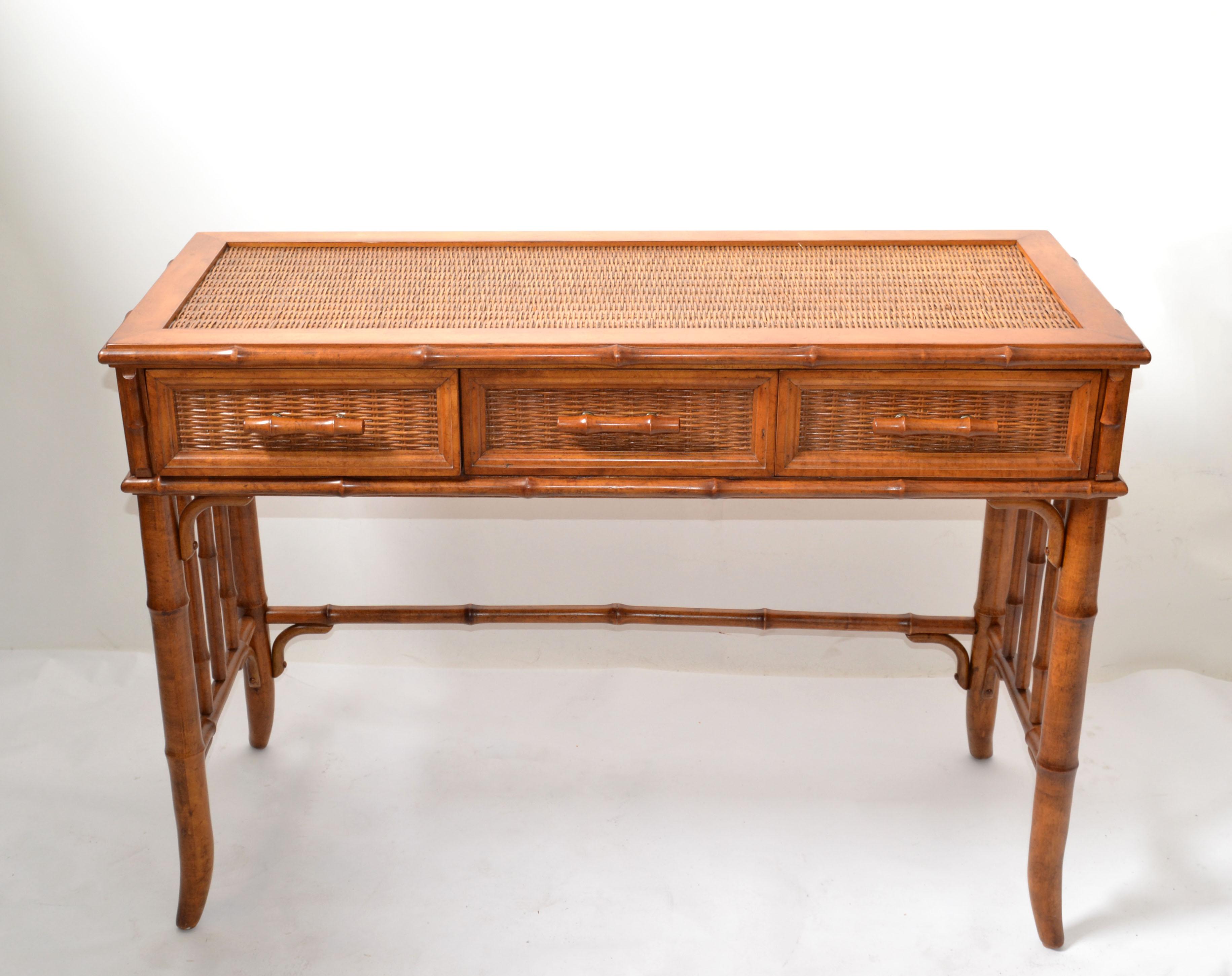 Original McGuire bentwood bamboo and handwoven cane writing table, desk with brass hardware.
McGuire metal tag is missing, was attached inside the Middle Drawer.
Fully restored and ready for a new Home.
Measures: Table knee clearance: 24.5