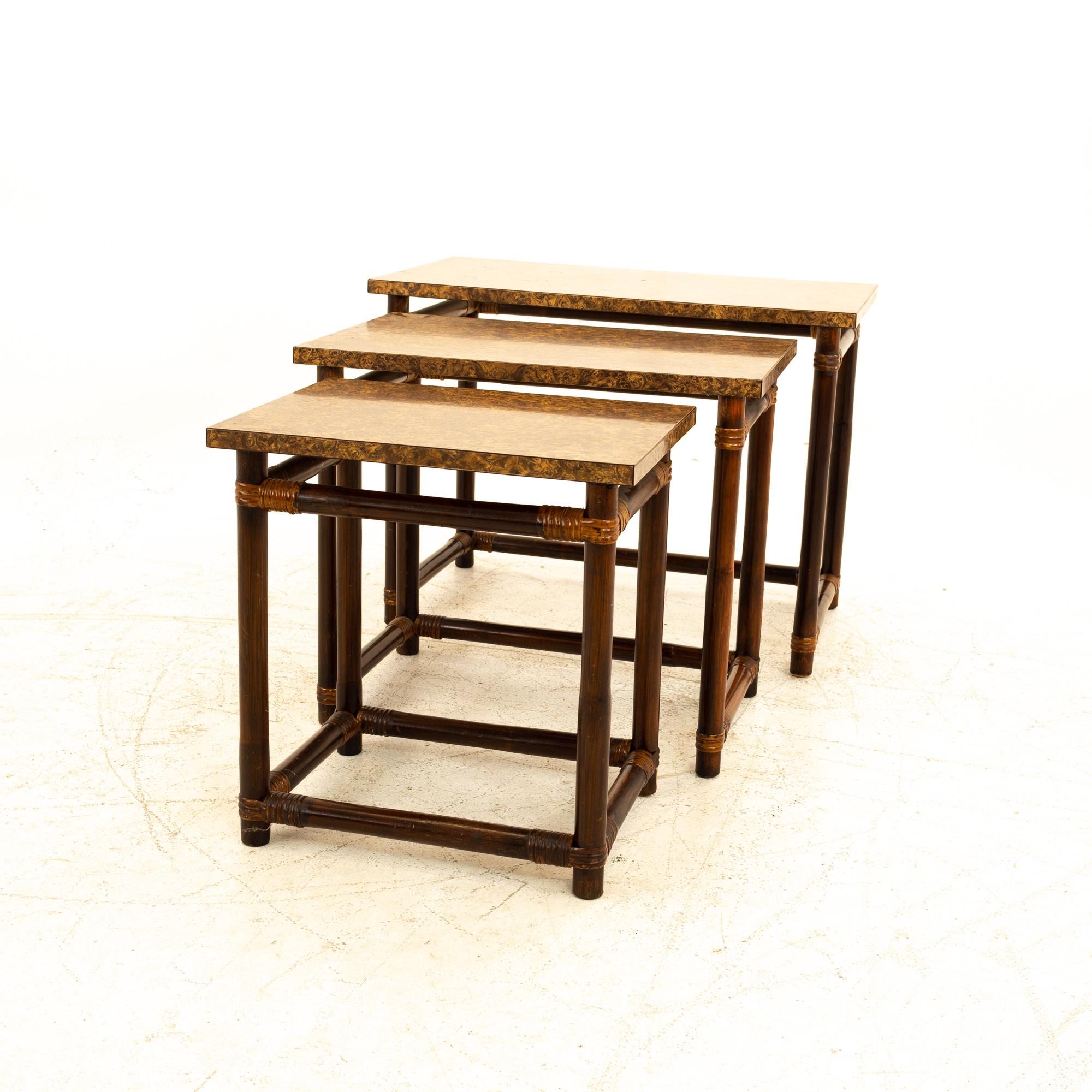 McGuire of California style Mid Century bamboo & burl wood laminate nesting tables

Largest table measures: 29 wide x 16.5 deep x 22 high
Middle table measures: 22.75 wide x 15.75 deep x 20.5 high
Smallest table measures: 18.25 wide x 13.5 deep x