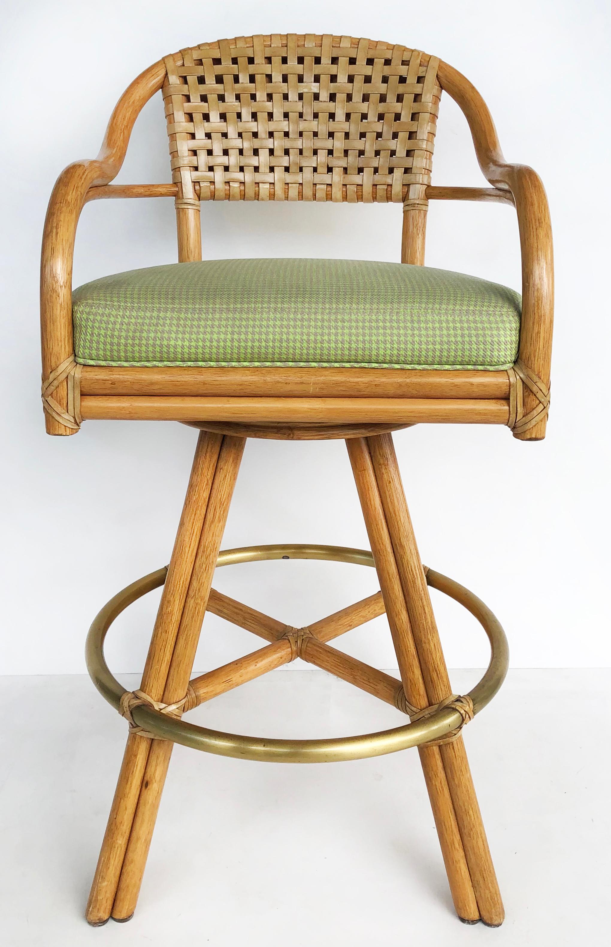 McGuire of San Francisco swivel bar stools in rattan, leather & brass, set of 3

Offered for sale is a set of three McGuire of San Francisco rattan swivel bar height stools. The backs are woven leather and the framed is wrapped in leather. The