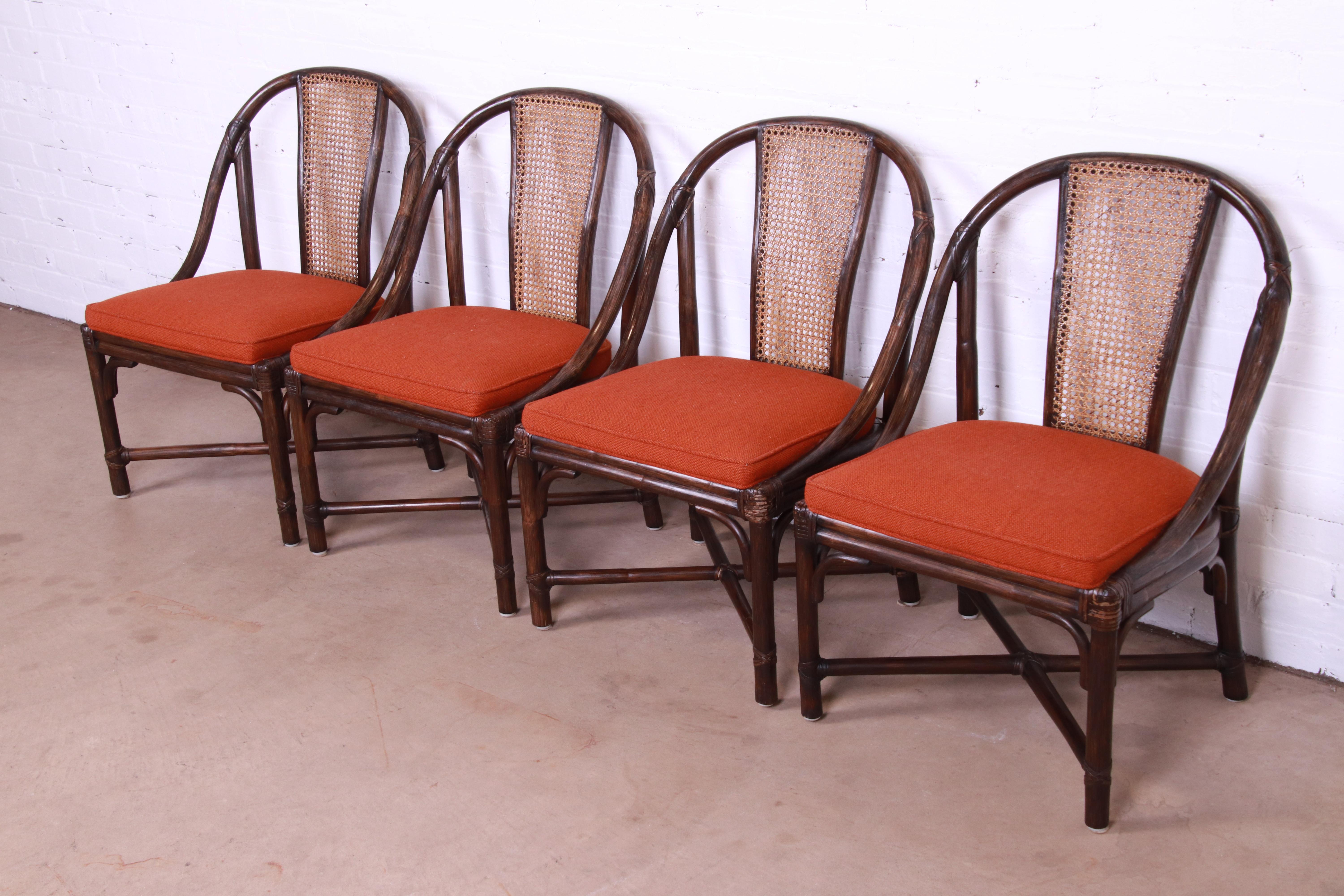 A gorgeous set of four Hollywood Regency Organic Modern x-base dining chairs

By McGuire

USA, Late 20th century

Bamboo and rattan frames, with caned backs and upholstered seats.

Measures: 20.75