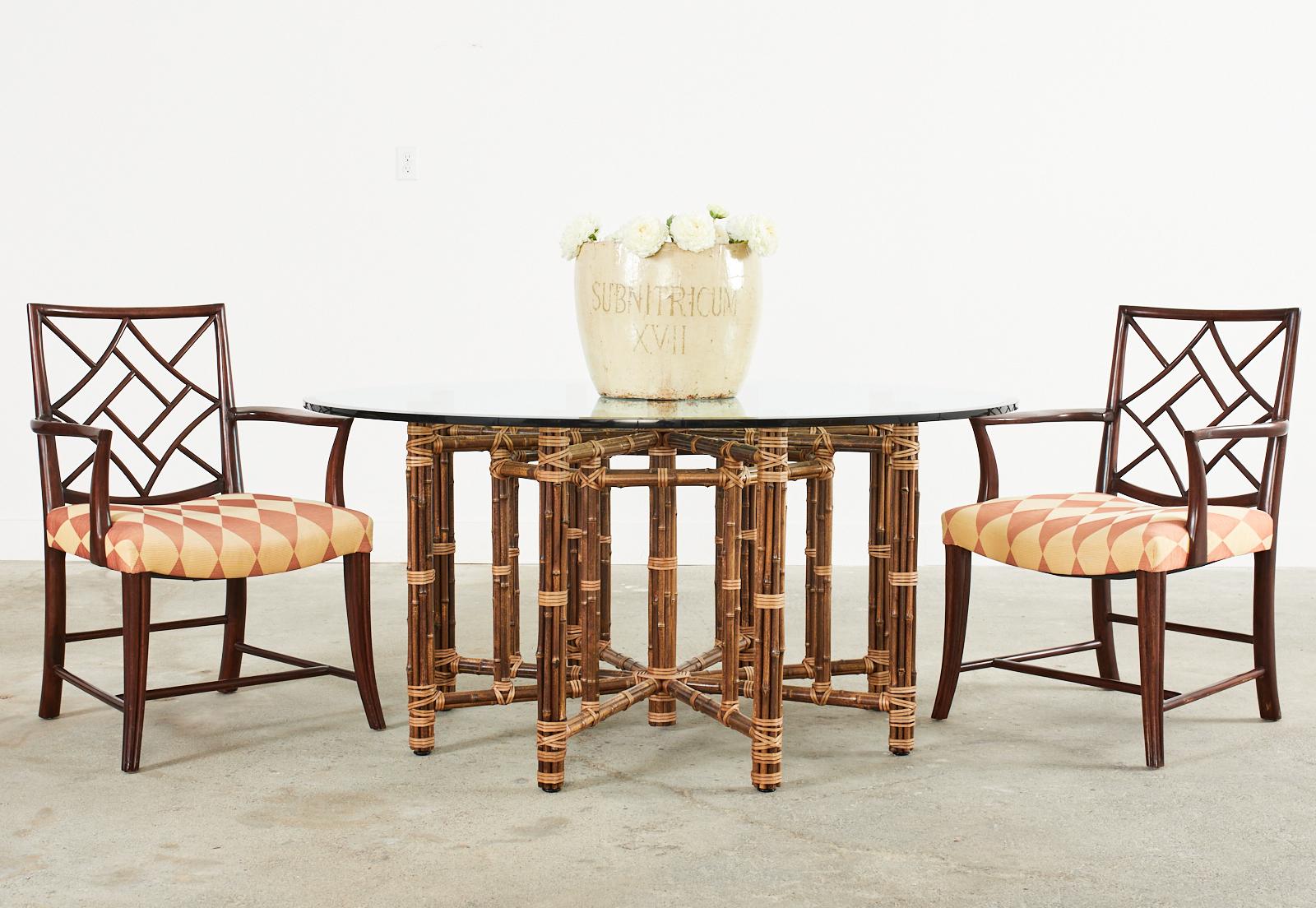 Amazing McGuire organic modern bamboo rattan dining table featuring an octagonal base seating for eight. Genuine McGuire, not a cheap reproduction with an iron frame painted golden gate orange for authenticity. Made in the California organic modern