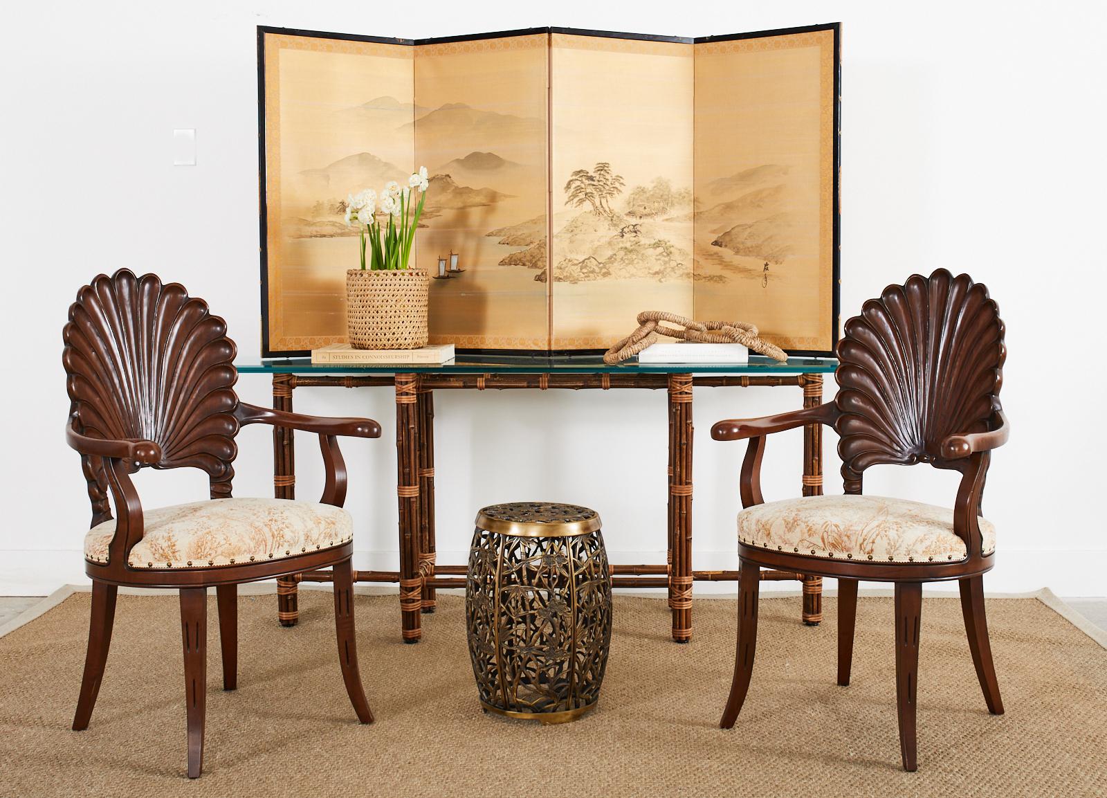 Genuine McGuire bamboo rattan style sofa table or console table made in the California organic modern style. The table features a large iron frame painted golden gate orange for authenticity. The frame is entirely covered with dark bamboo poles