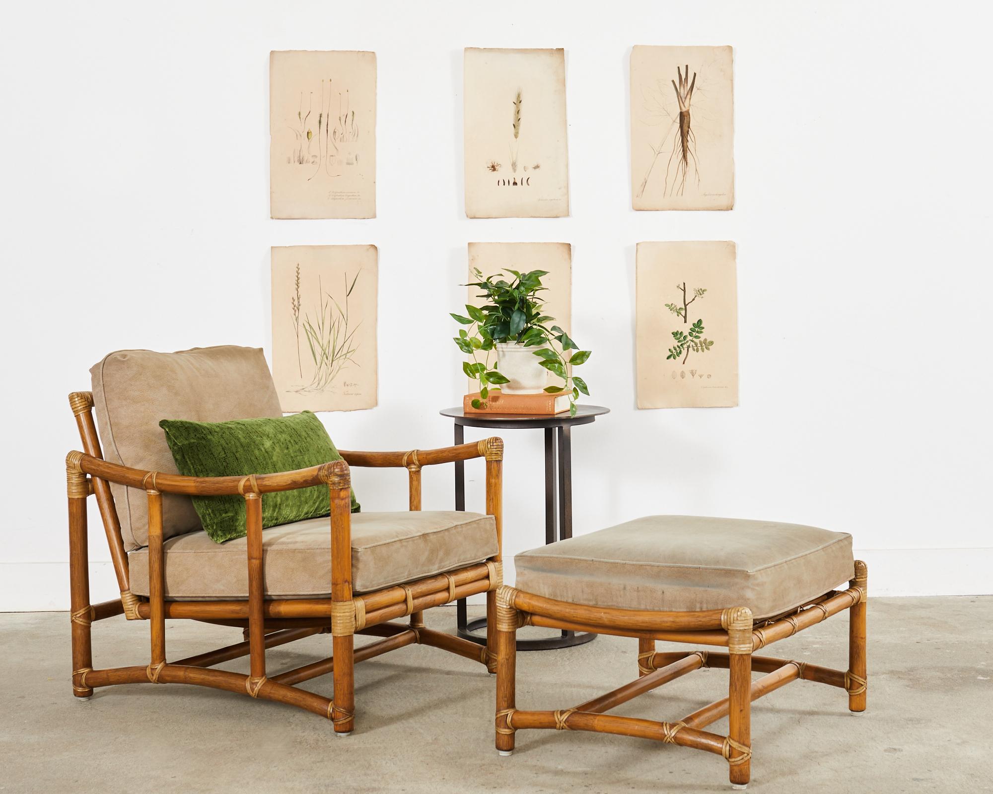 Distinctive and rare bent pole rattan lounge chair and matching ottoman made in the California coastal organic modern style by McGuire. The pair feature gracefully curved bent rattan frames with upswept arms and arched legs. The thick rattan is