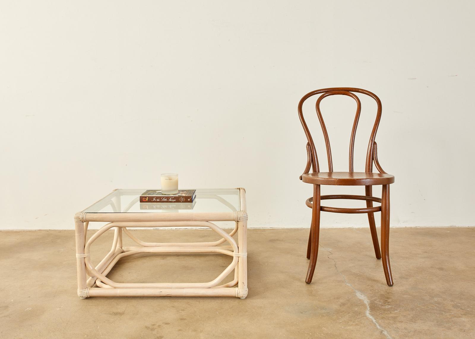 Lacquered bamboo rattan coffee or cocktail table featuring a cerused or whitewashed finish made by McGuire. Beautifully crafted in the California organic modern style with rattan poles bent and lashed together using leather rawhide laces on the