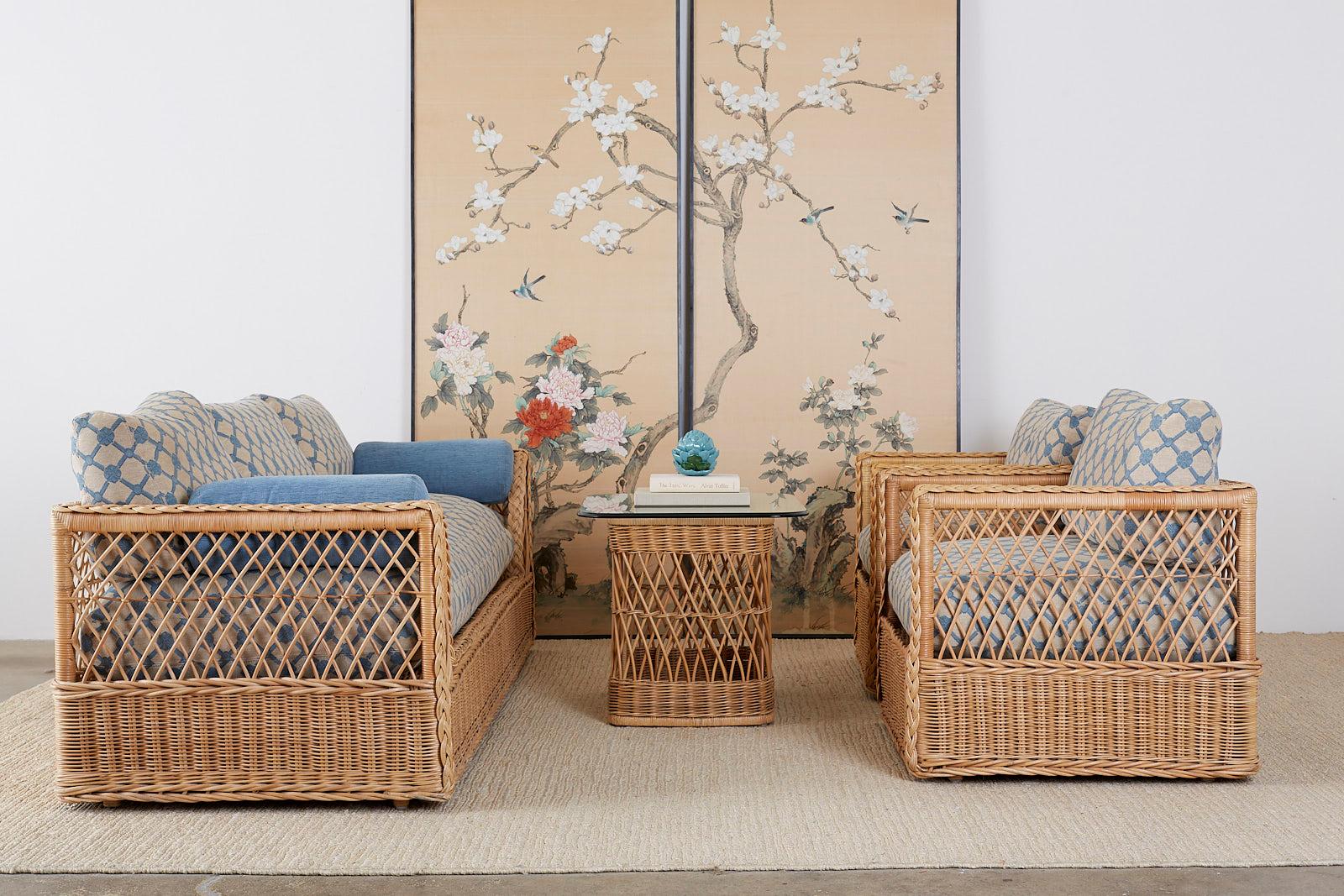Extraordinary organic modern rattan and wicker daybed sofa made by McGuire. Features a large wood woven rattan and wicker frame decorated with a braided border. The sides and back have an open fretwork geometric pattern inset. The sofa is topped