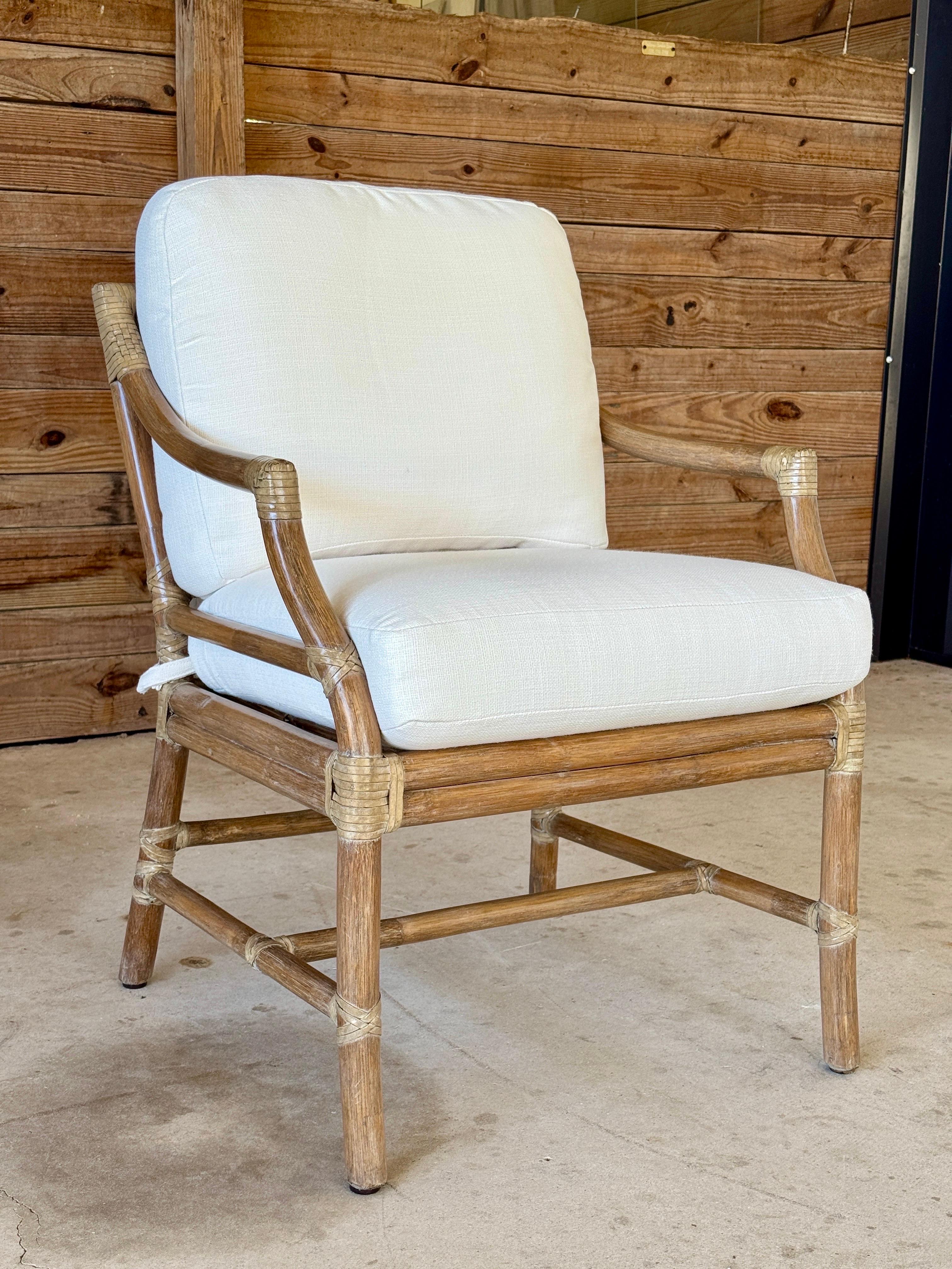A timeless blend of craftsmanship and comfort, this pair of McGuire lounge chairs showcases their signature rattan construction with a distinctive target back design.
Lightly refinished, the frames retain their organic modern appeal with natural